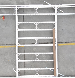 Empty white metal shopping cart on concrete ground with yellow parking lines