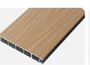 Close-up of a wooden-textured composite decking board with a hollow core and black interior
