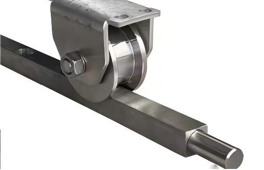 Close-up of an industrial roller and metal rod