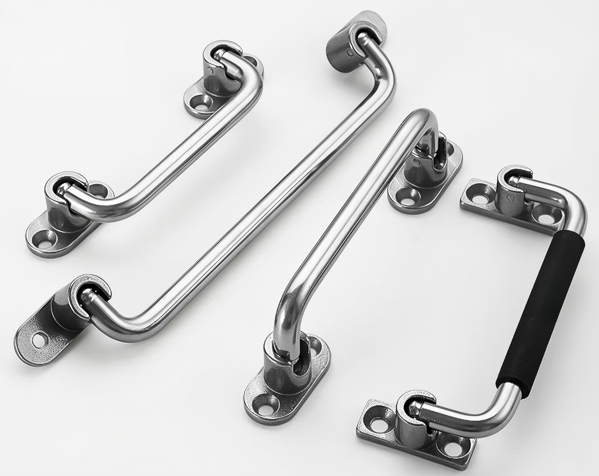 Three metal handles, two with black grips and one without, on a white background.