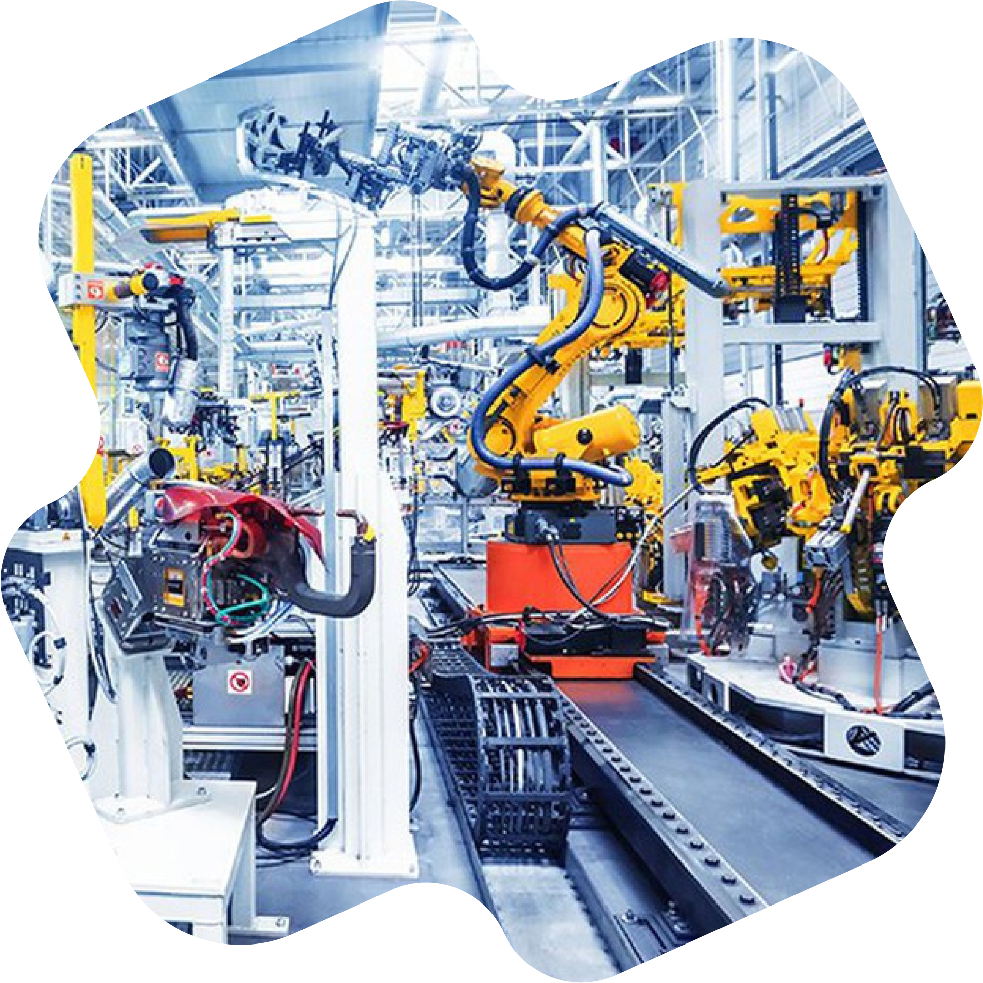 Usine avec des bras robotiques dans une chaîne de montage automatisée.