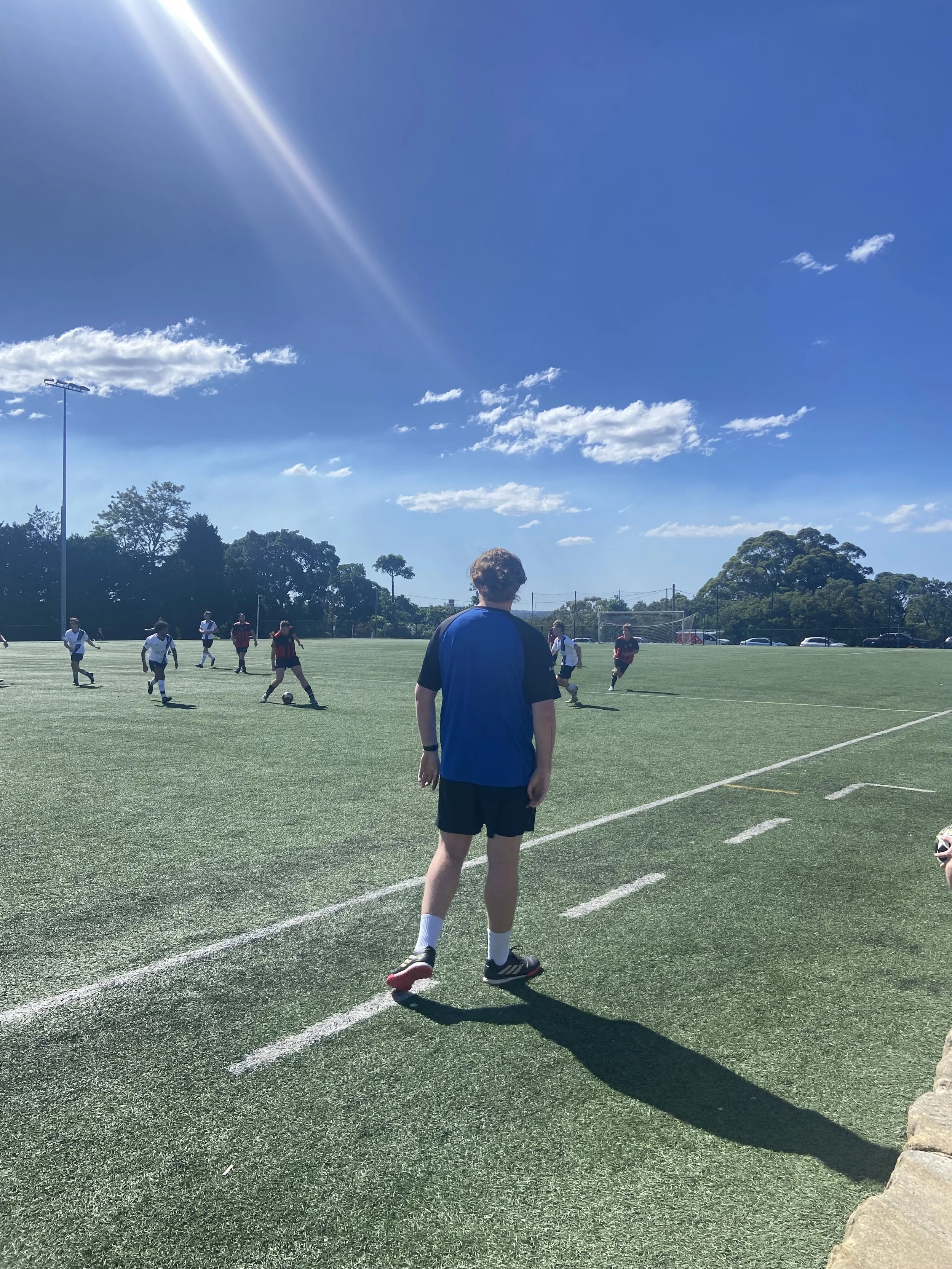 A Harbour Goalkeeper Coach on the sidelines providing advice during the game on Sydney's North Shore and Northern Beaches