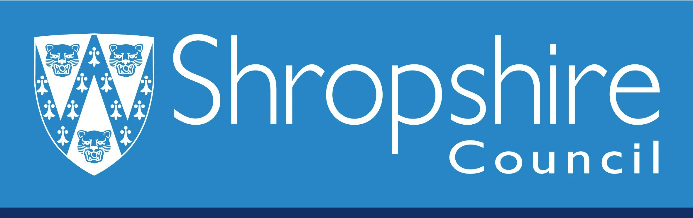 Logo of Shropshire Council featuring a shield with three lion heads and floral patterns, on a blue background.