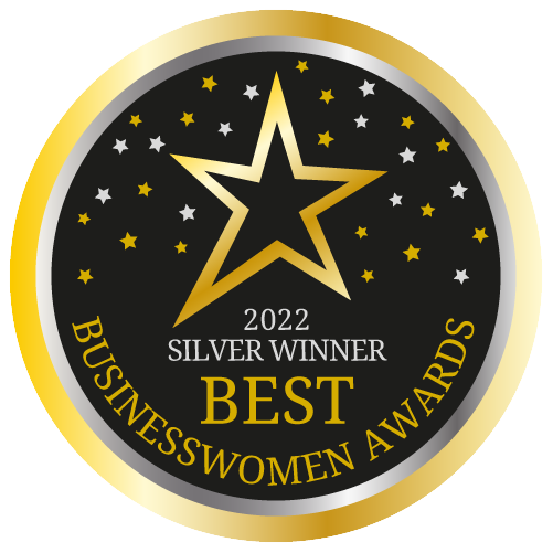 Gold and black circular badge with a gold star and smaller stars, reading '2022 Silver Winner Best Business Women Awards'.