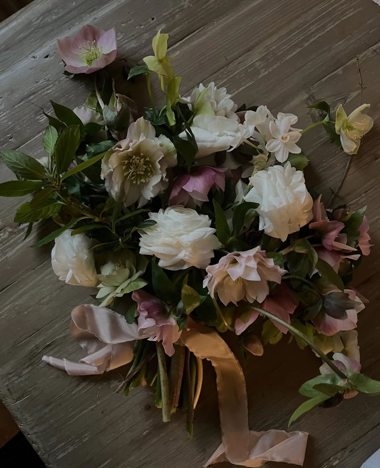 Seasonal, tonal, and quietly romantic.
Hellebores, ranunculus and paperwhite narcissi &mdash; a bouquet for couples who want their flowers to reflect the time of year.

I still have a small number of late 2026 dates available, if you love seasonal fl