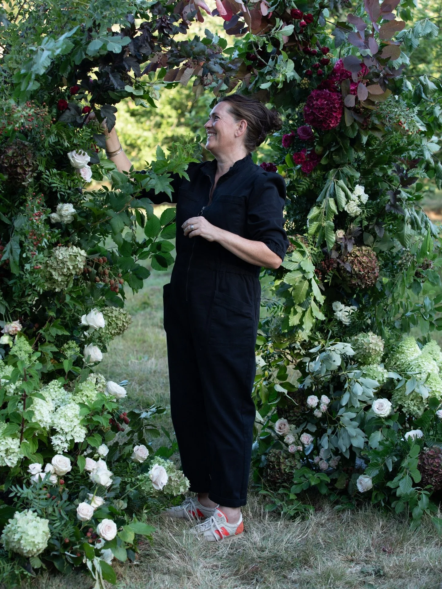 The orchard really led the way with this arch.

The foliage, as always, was as important as the flowers &mdash; fresh greens, deep burgundy and warmer autumnal tones, with wild dog rose, hawthorn berries, blackberries and apples woven through. Deep r
