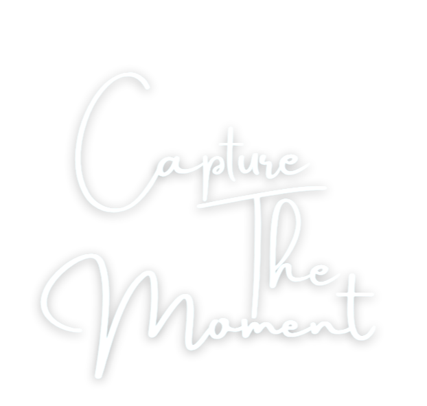 Quote that says "Capture the Moment" in white handwritten-style text on a black background.
