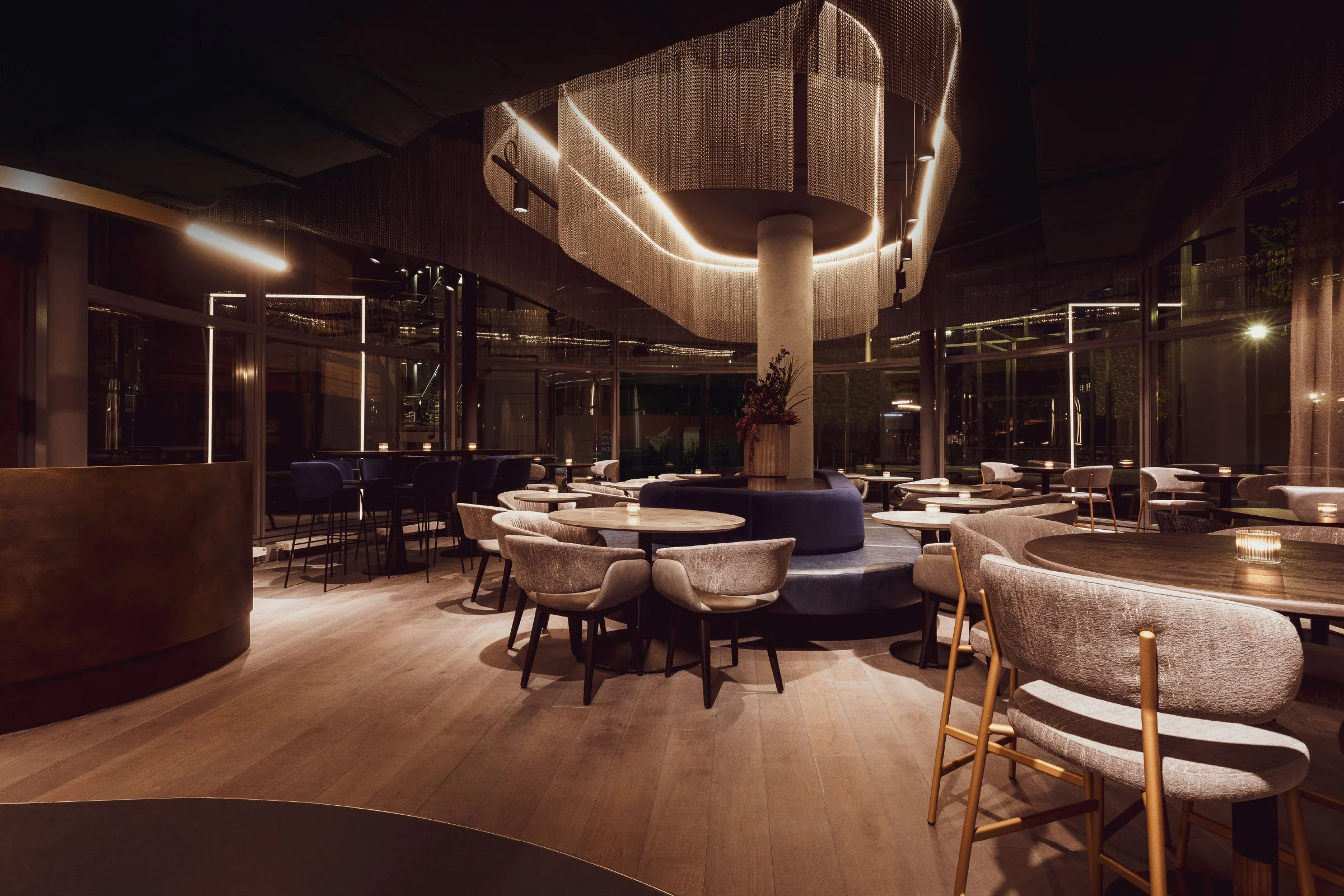 The design of The Alchemist Berlin delivers a bold fusion of industrial edge and contemporary elegance—where moody lighting, sleek metallic finishes, and immersive spatial flow create a visually striking, high-energy environment that defines Berlin’s