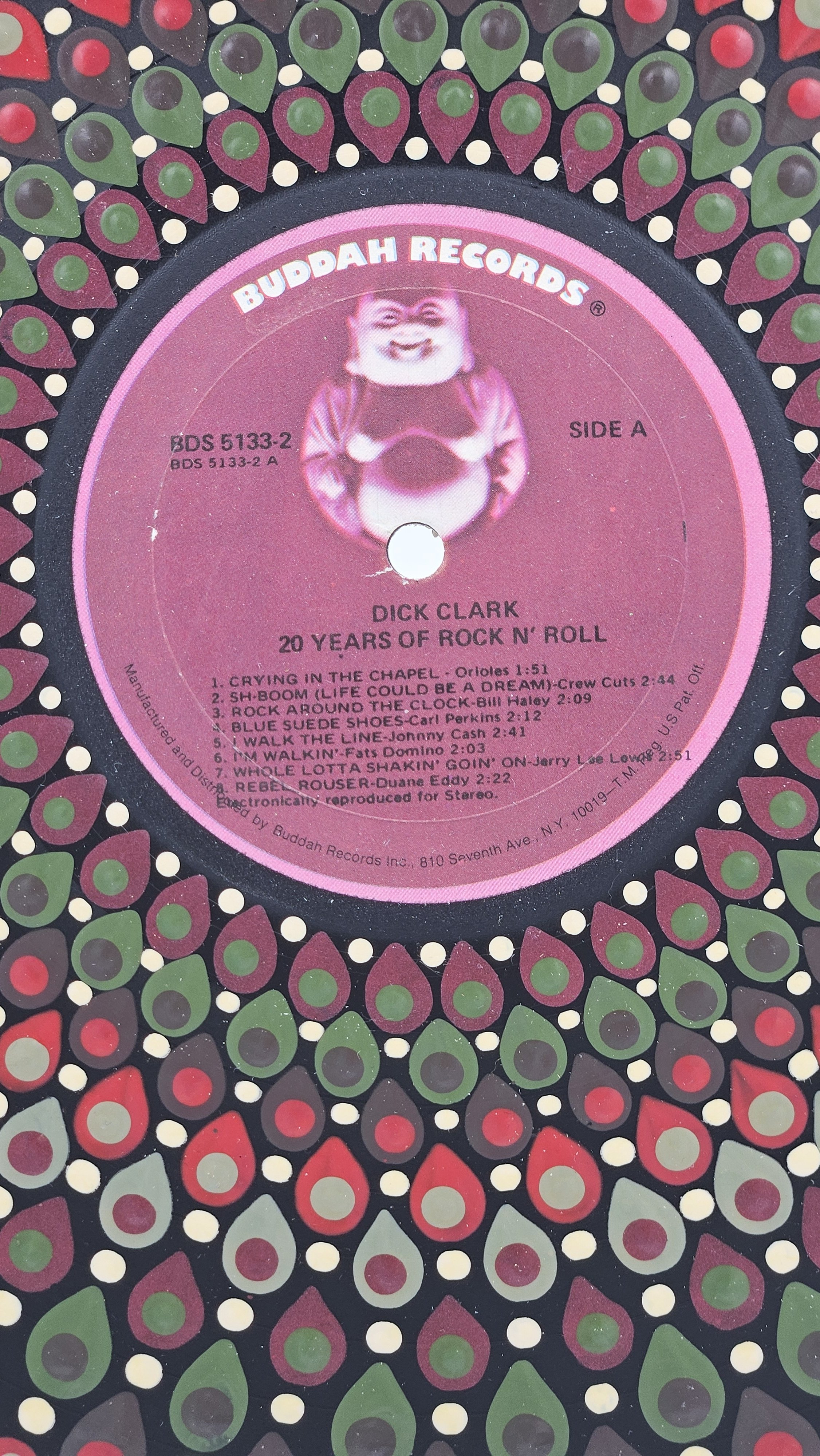 Close-up of the original pink Buddah Records label for Dick Clark’s 20 Years of Rock N’ Roll, surrounded by the hand-painted mandala.