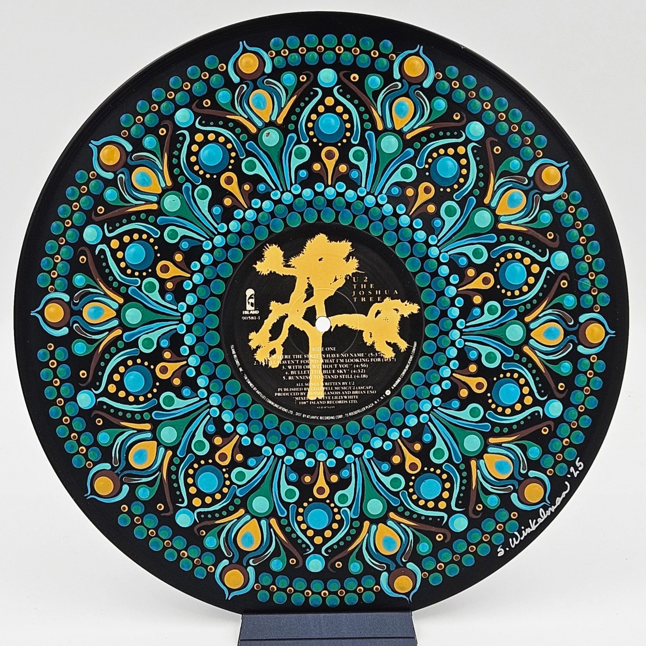 Hand-painted vinyl record art with mandala and tree design