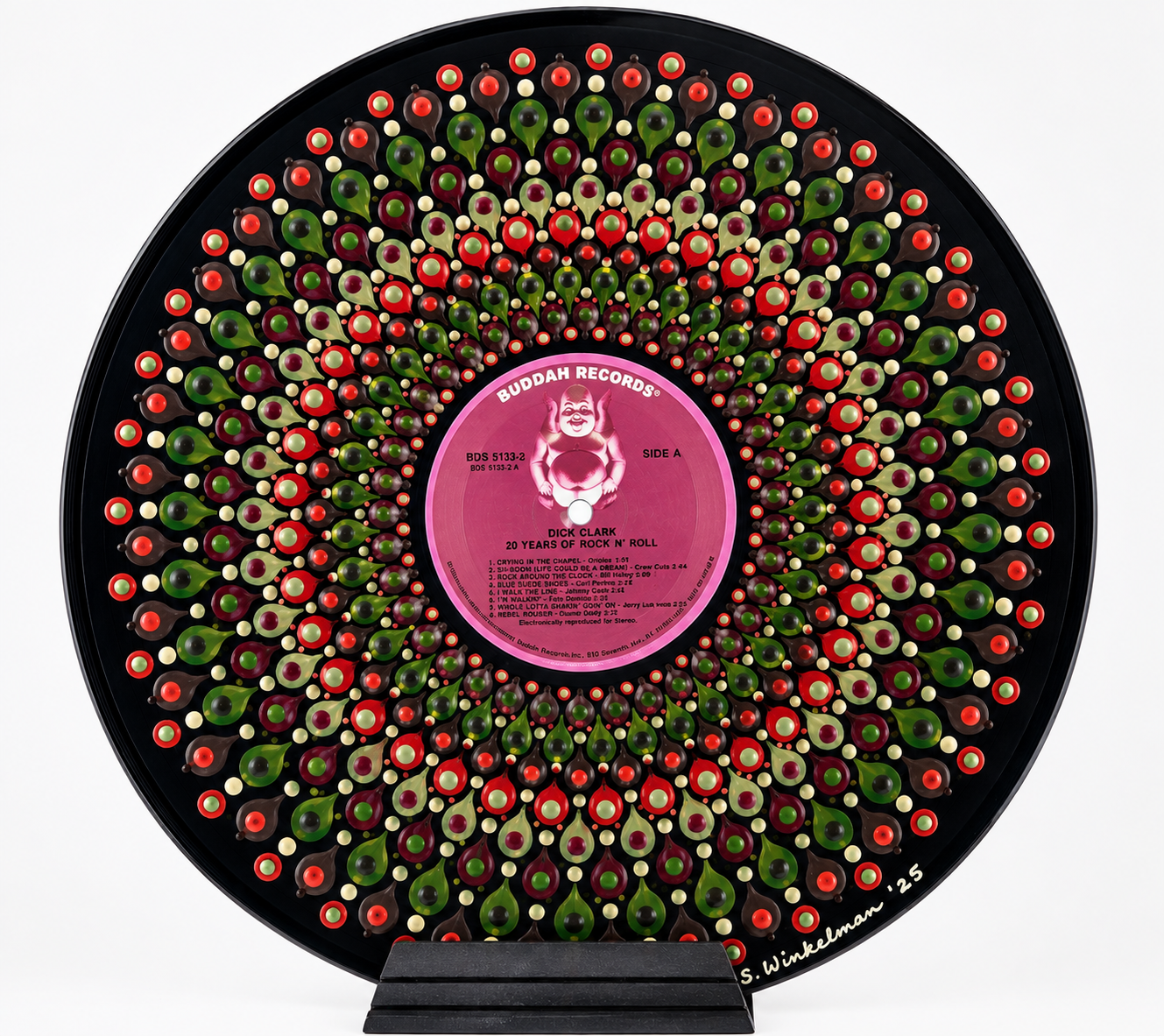 Hand-painted vinyl record featuring a symmetrical mandala in red, burgundy, green, cream, and charcoal surrounding the original pink Dick Clark Buddah Records label.