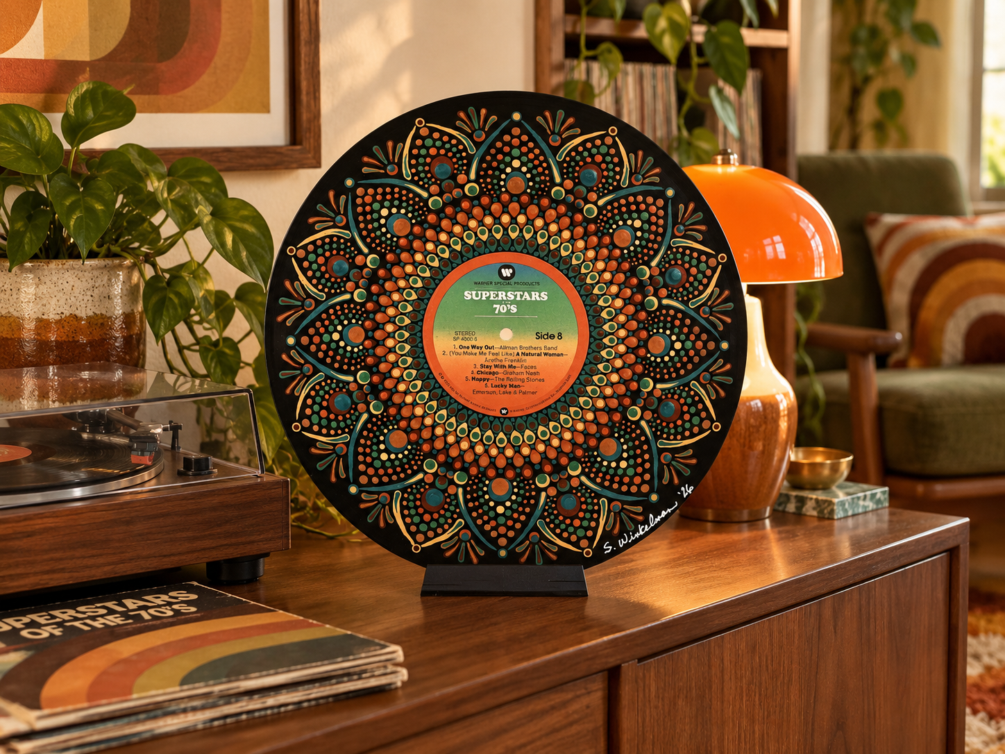 Superstars of the 70's Side 8 hand-painted vinyl record art displayed unframed on a tabletop stand in a retro 1970s room