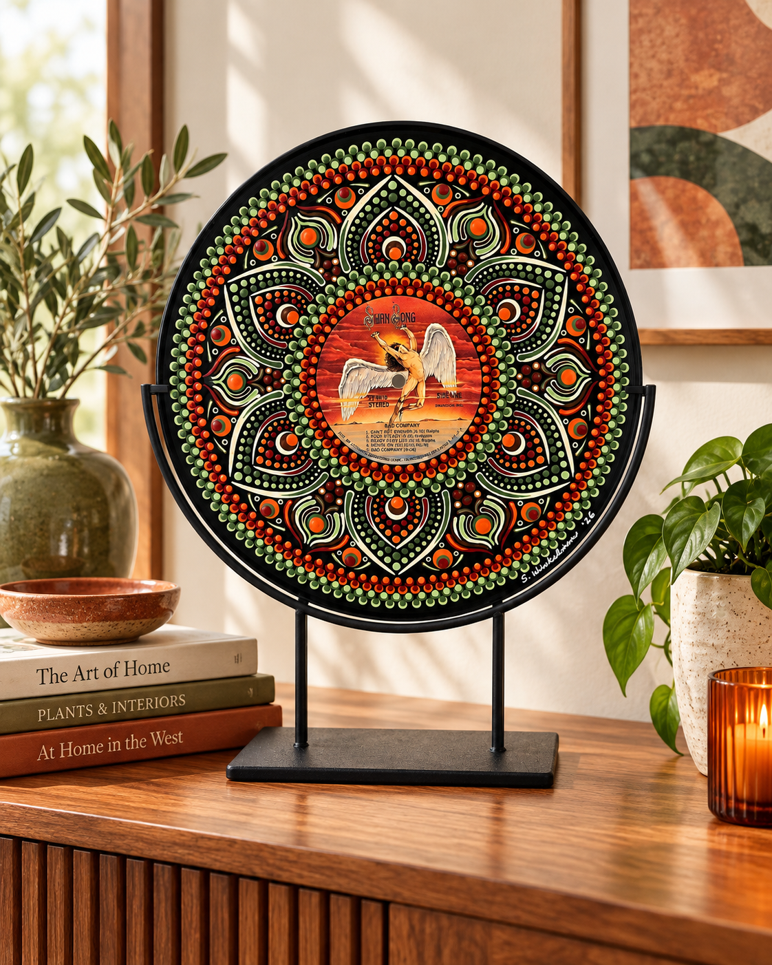 Bad Company hand-painted vinyl record art displayed on a wooden console with coordinating terracotta, olive green, and cream home accessories. Display stand not included.