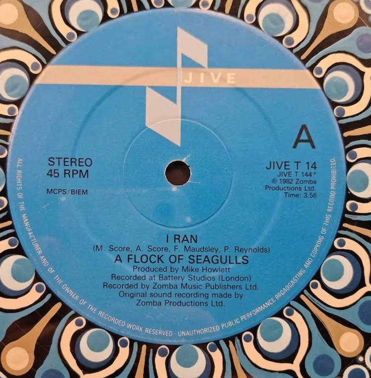 Original blue Jive Records Side A label for “I Ran” by A Flock of Seagulls surrounded by painted mandala details.