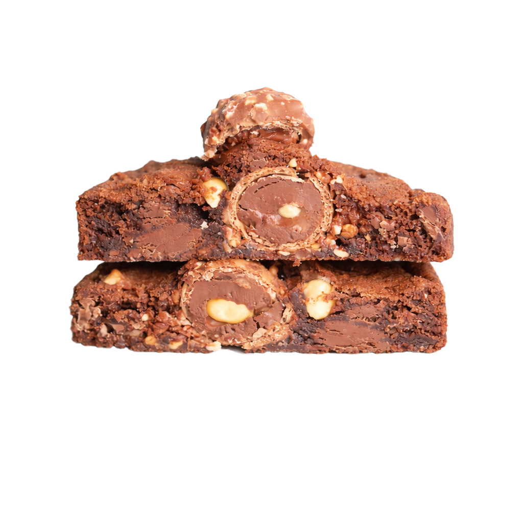 Close-up of stacked chocolate rocky road with marshmallow, nuts, and chocolate.