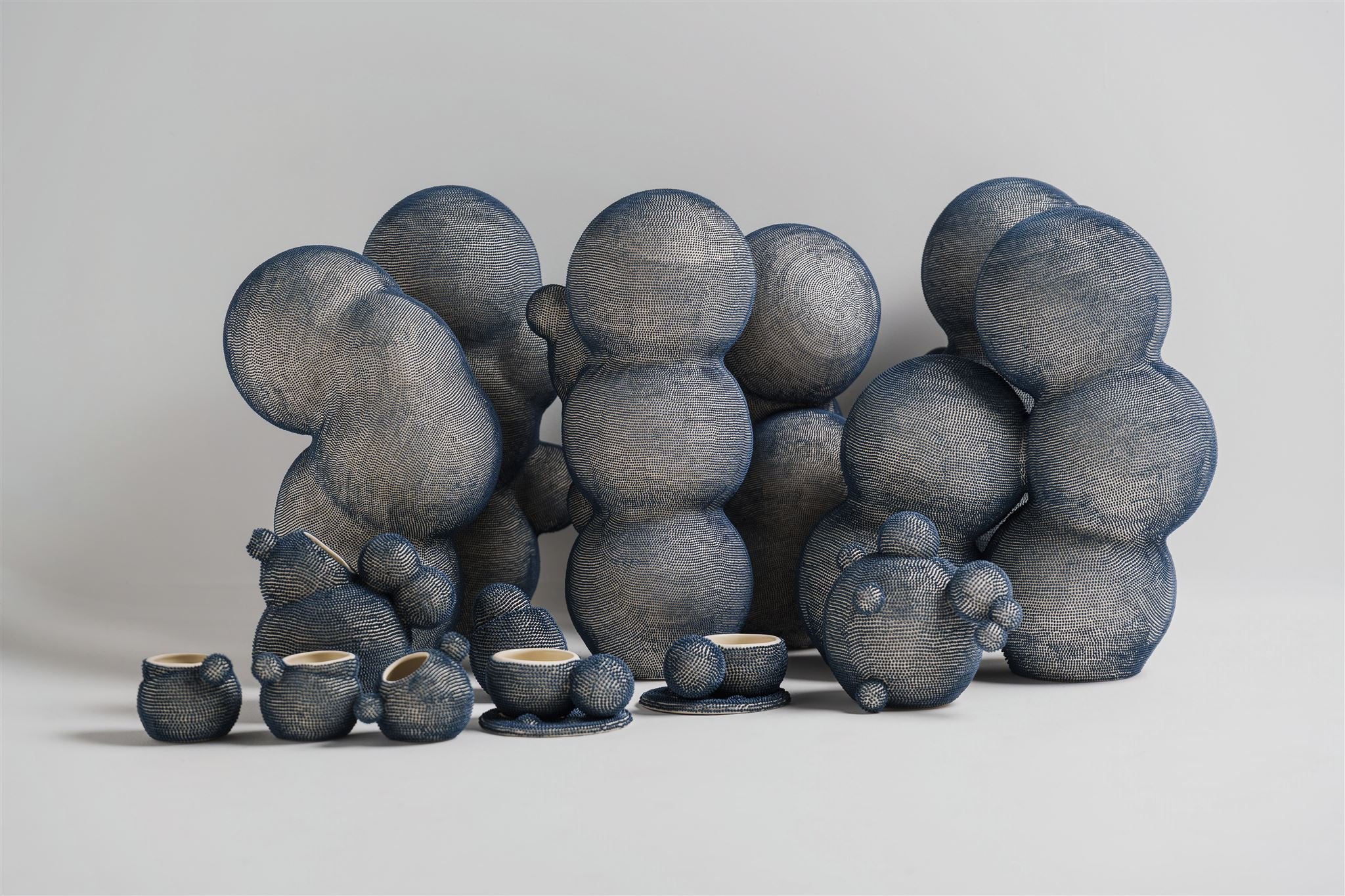 Mamanas, 2026. Ceramic sculptures from the Mamanas serie in stoneware, composed of organic hand-built forms with delicate blue engobe dots applied by hand.