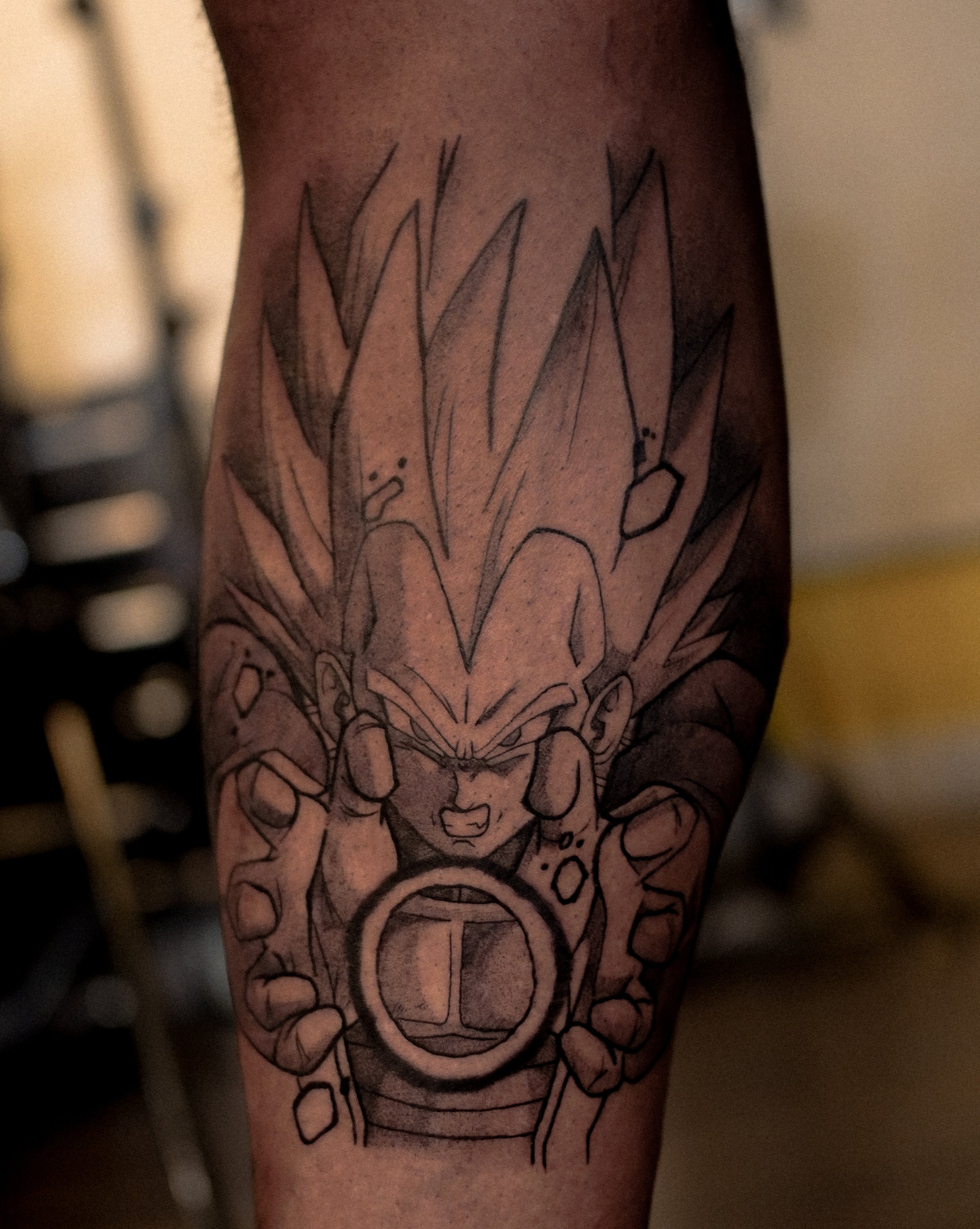 A tattoo on a person's arm featuring a line drawing of a woman with flowers and decorative elements around her face.
