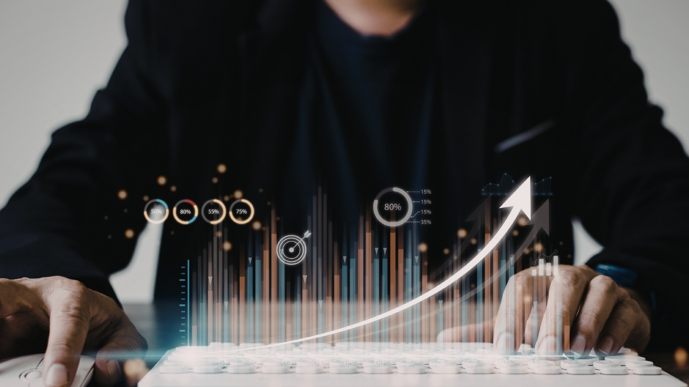 Person in a dark jacket interacting with a digital graph showing upward growth, with bar charts and various percentage indicators.