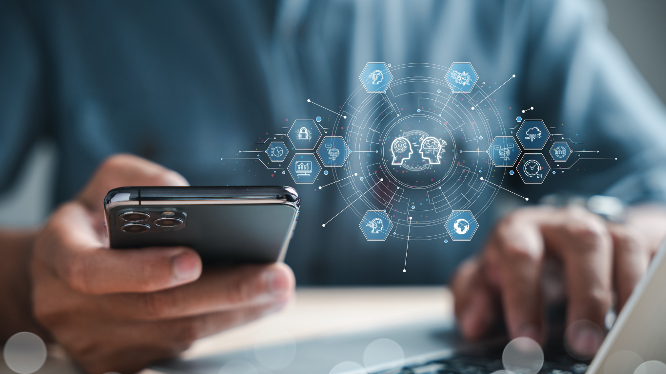 A person holding a smartphone with a digital interface showing AI and technology icons projected in front of them.