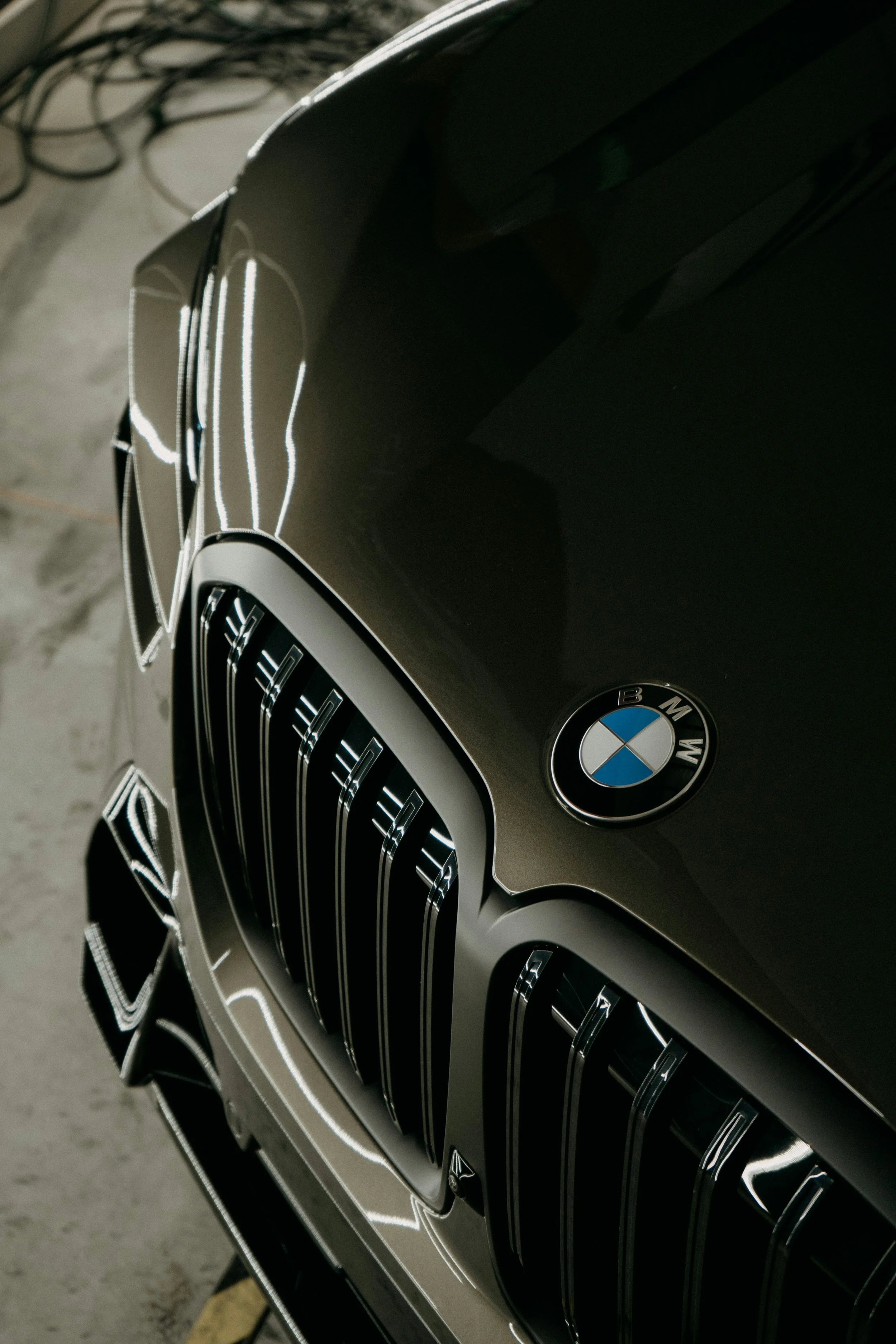 Close-up of the front grille of a BMW car with the BMW logo visible.