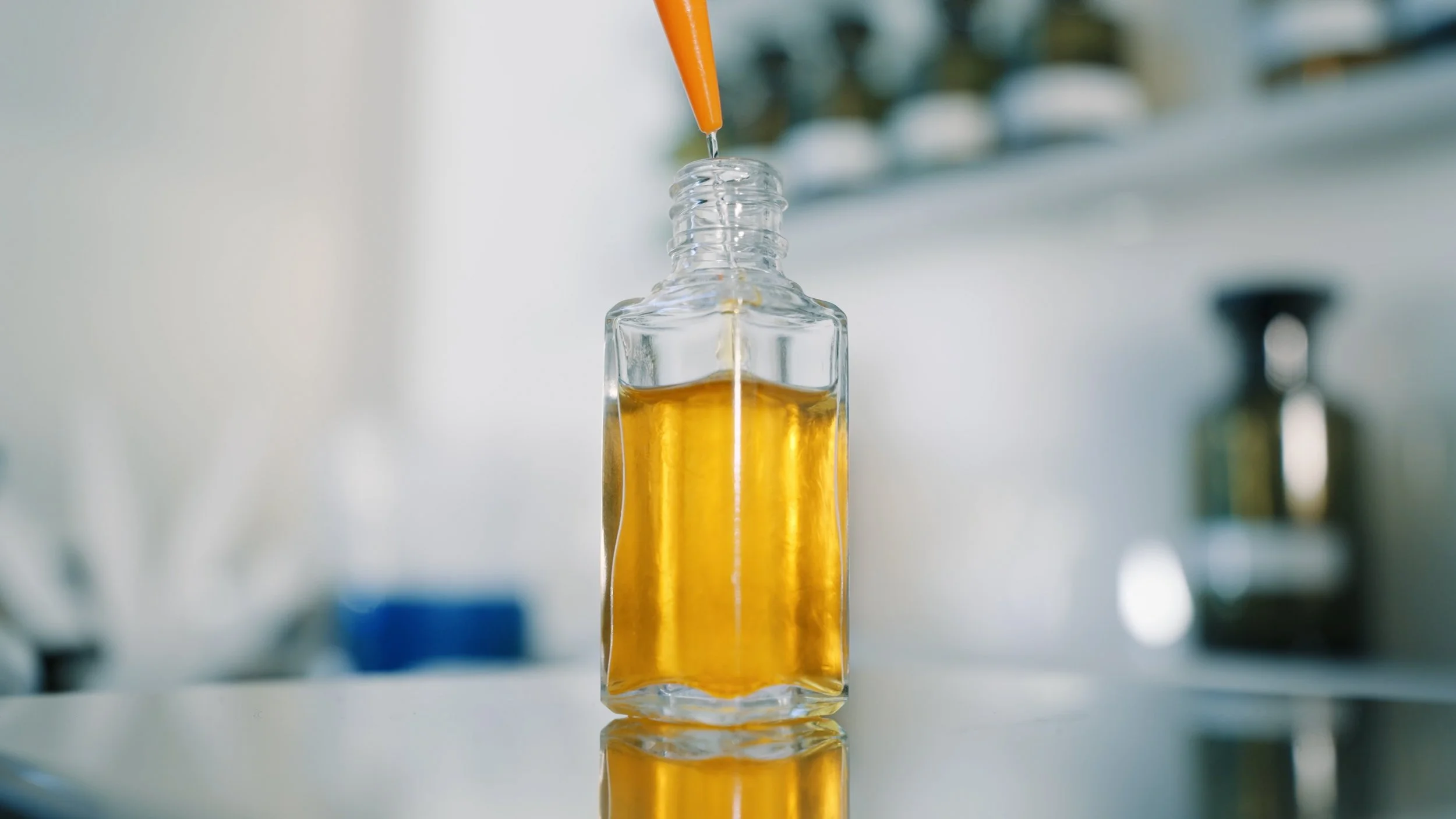 Close-up of perfume formulation in a fragrance laboratory.