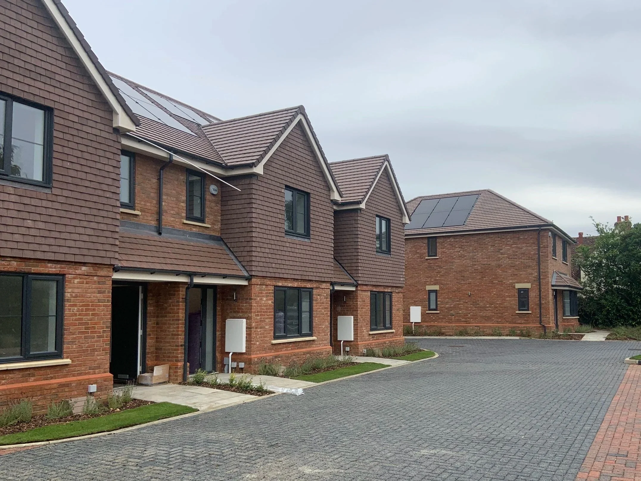 A row of modern brick townhouses