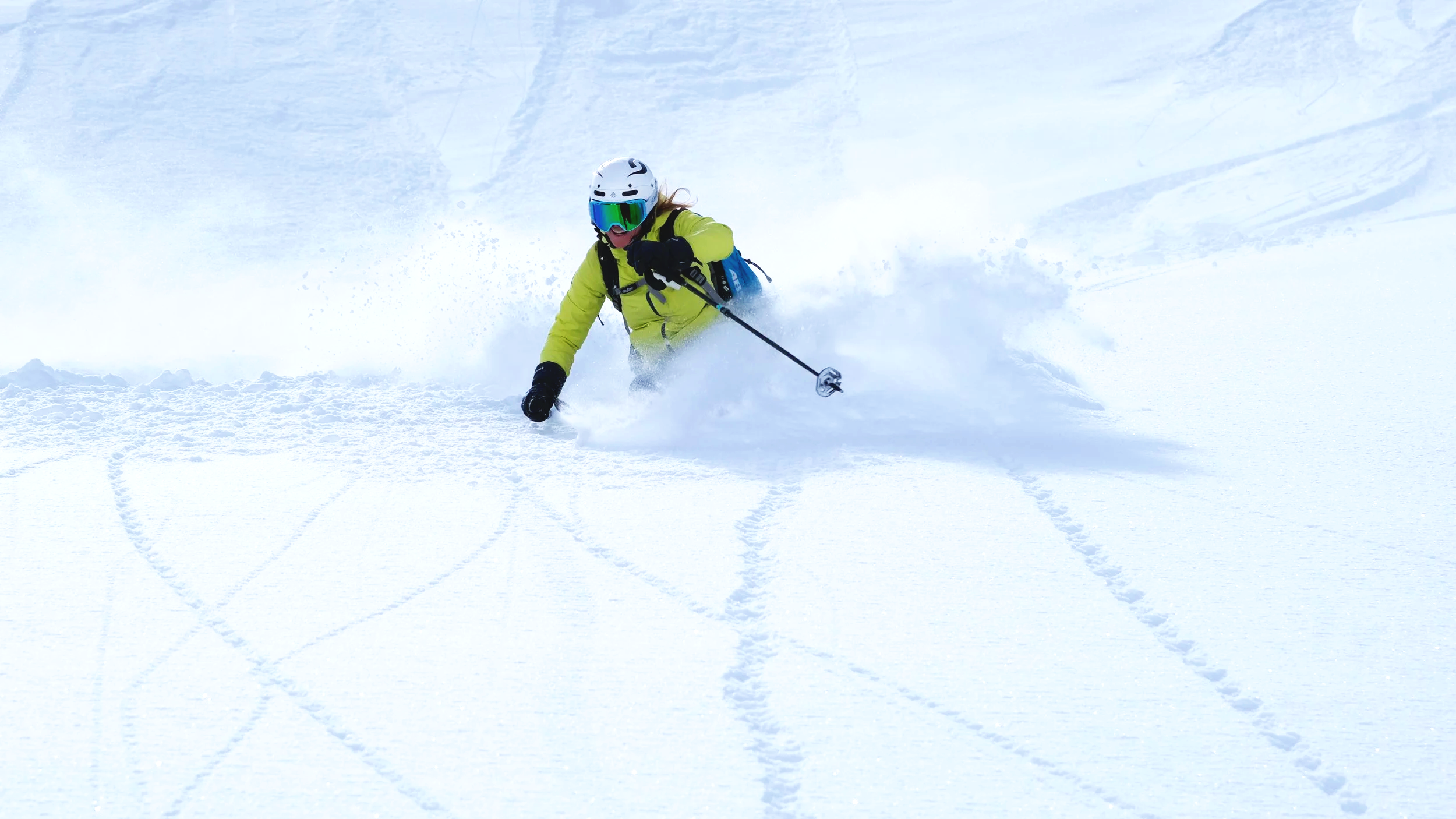Off-piste skiing in fresh powder snow with a private ski guide in the mountains of the Engadin, Switzerland.