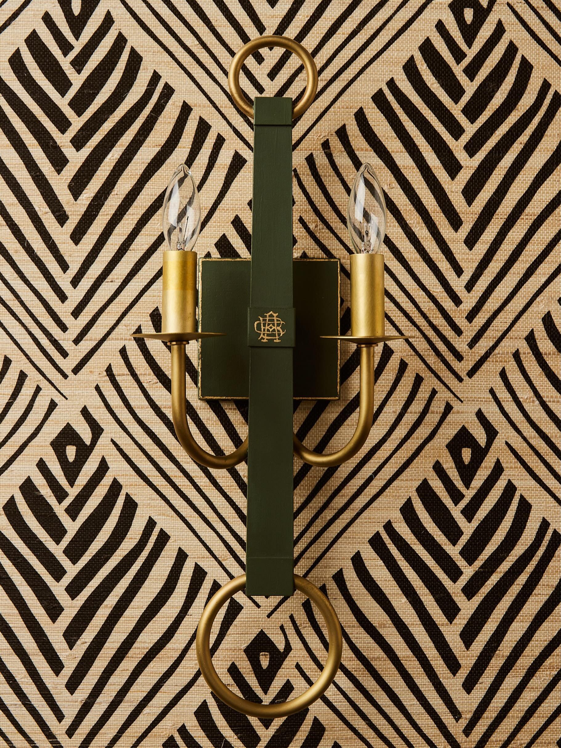 Such a pretty backdrop for our large scale sconce no. 5. This wallpaper is Bahia Grasscloth by @serenadugan sourced through our friends at  @thedesignsocialstudio 
The sconce is painted in a custom green with standard gilding + a masculine strapwork 