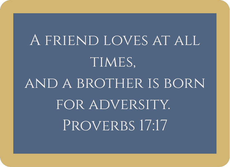 A framed quote on a blue background with beige border: "A friend loves at all times, and a brother is born for adversity. Proverbs 17:17"