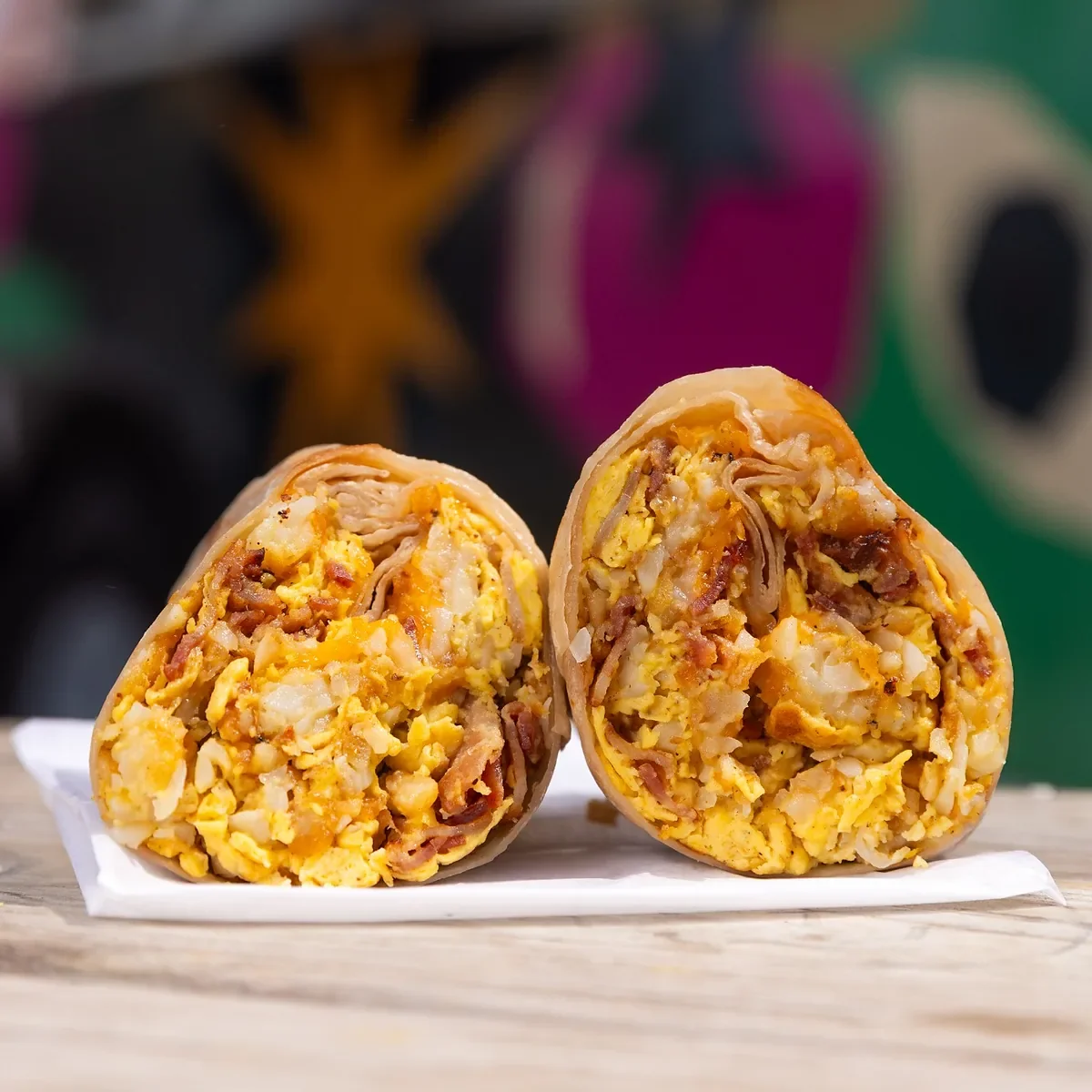 Resting Burrito Face B3 Bacon breakfast burrito with thick-cut bacon, three eggs, cheddar, and crispy tots in Nashville