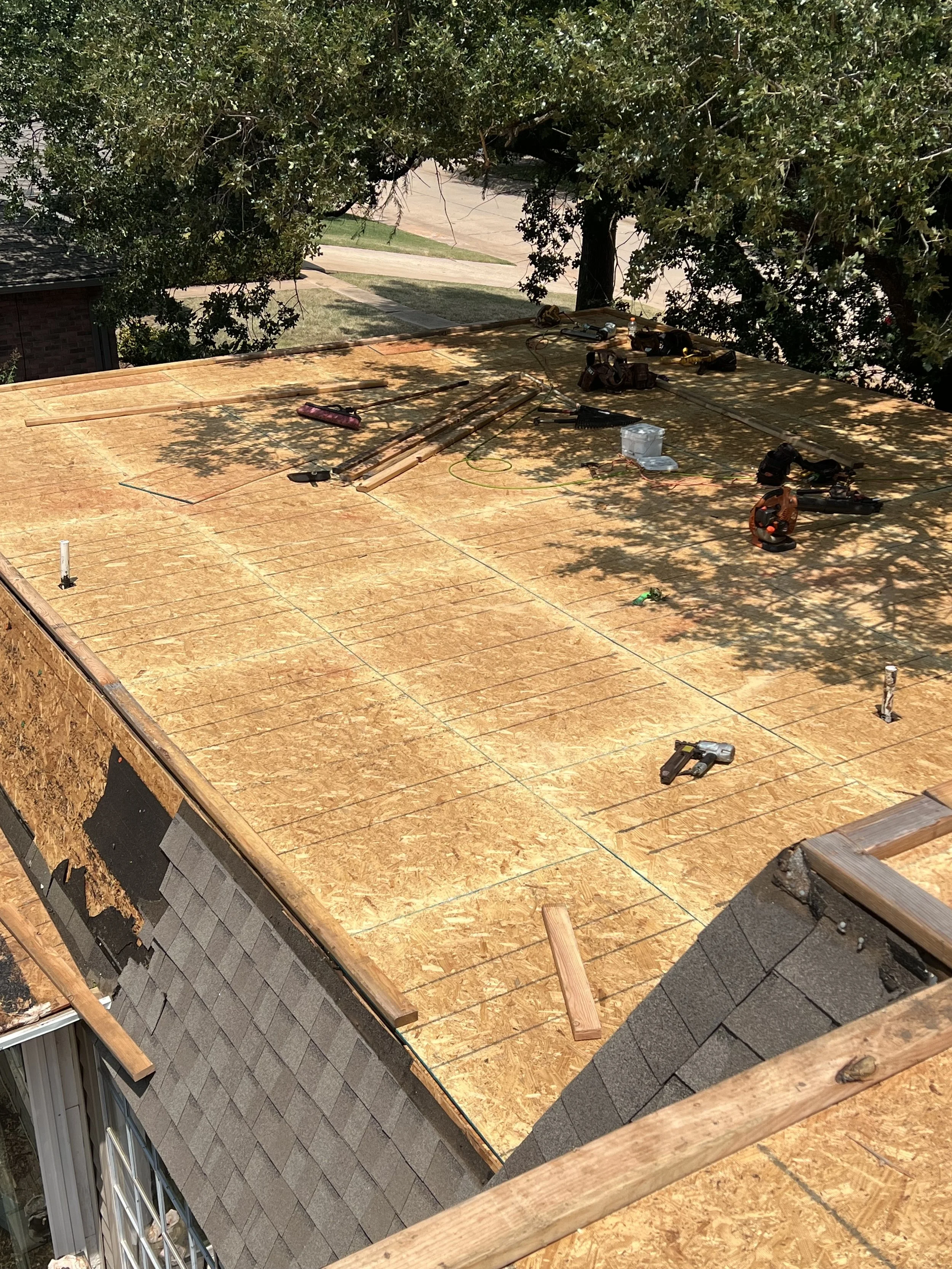 
Residential flat roof repair in progress following storm-related damage. Proper preparation and repair of damaged roofing materials, seams, flashing, and roof penetrations help restore a watertight roofing system. Bulldog Restoration provides reside