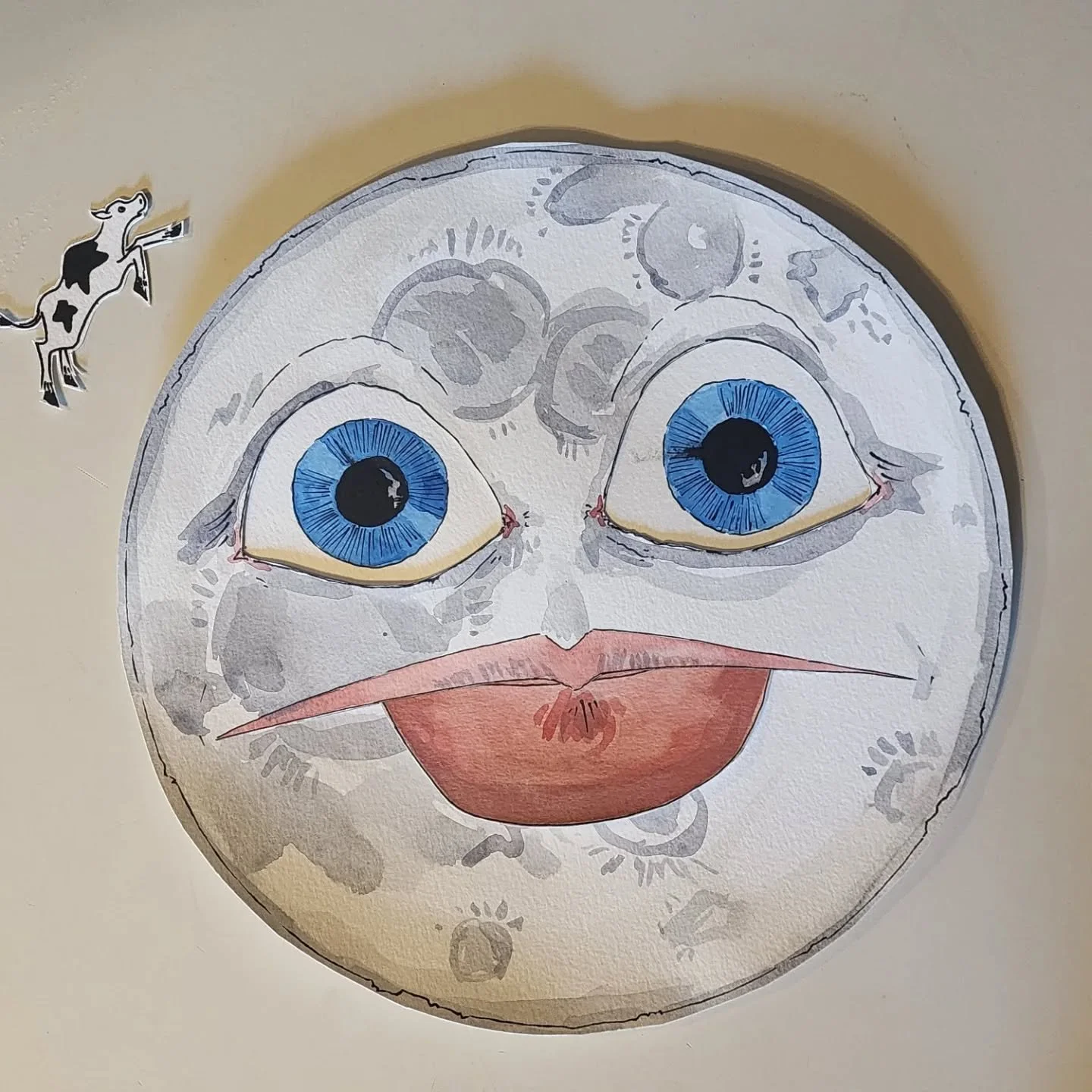 #papercraft nonsense. 15" moon with friction posable eyes and mouth, now on display on my office door. Why? Because my office is next to the boss's, which is where high level donors are brought, and damn if it doesn't make me laugh to think that