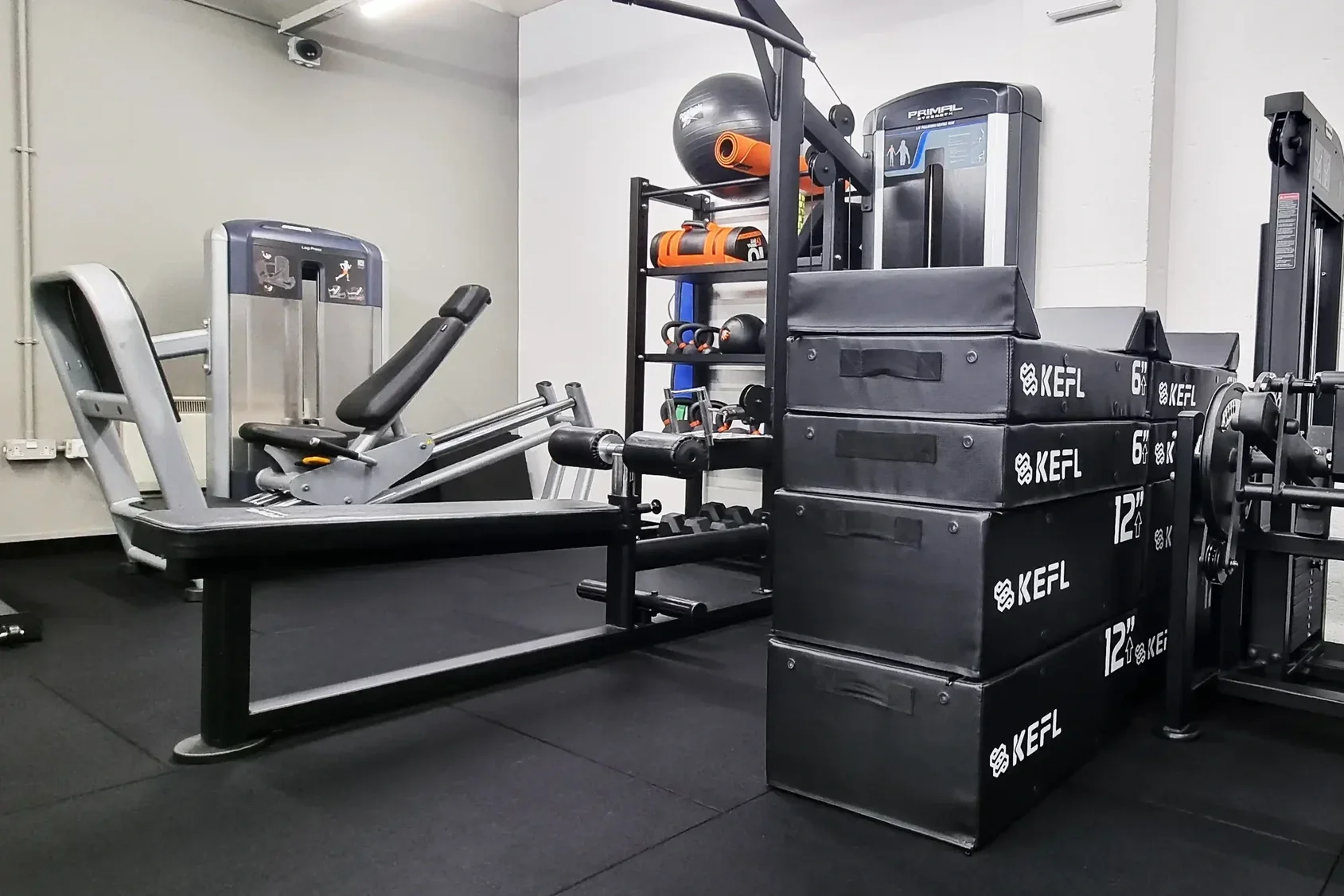 Leg press and lat pulldown machine in a semi-private gym