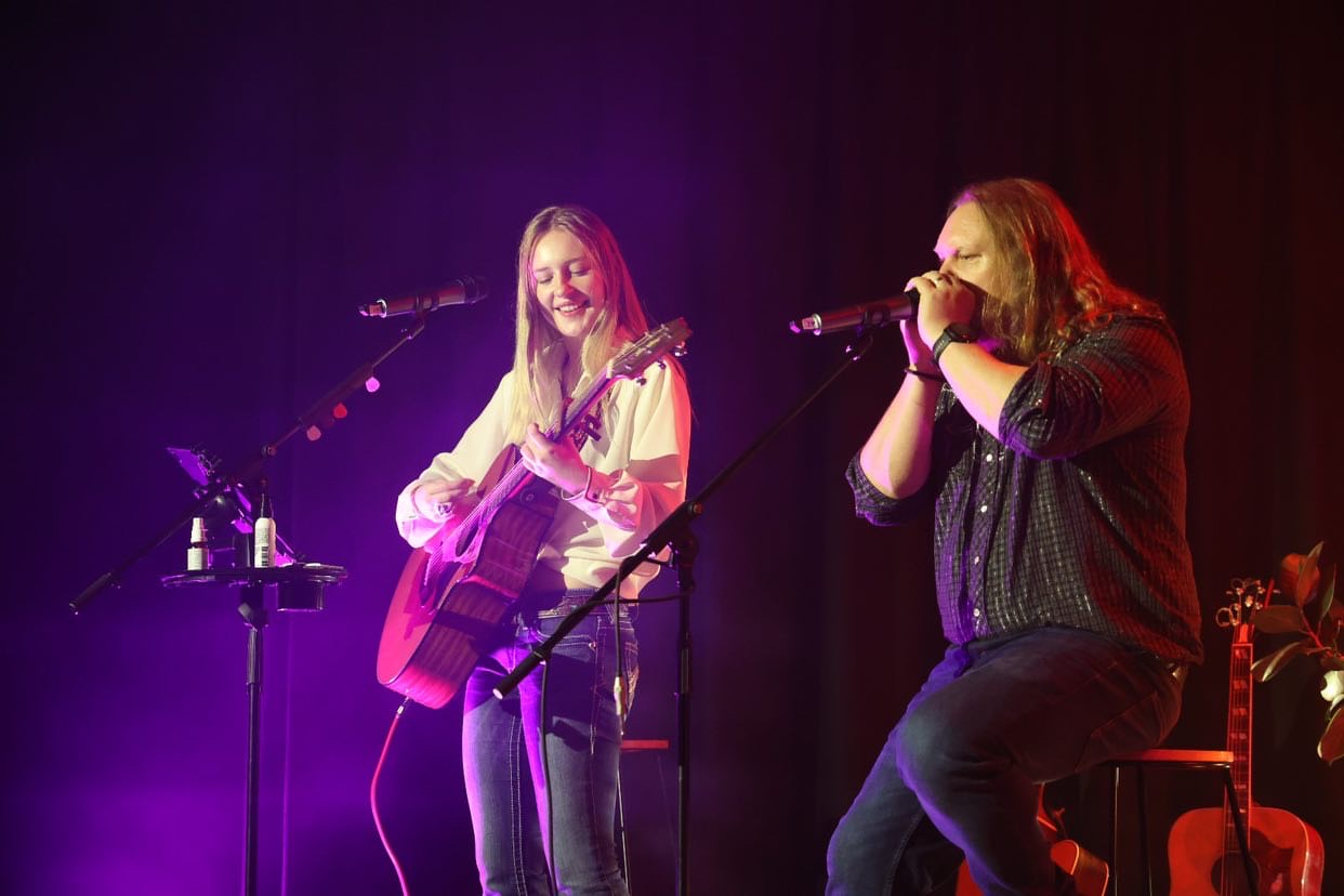 A photo of two musicians performing at the UXBRIDGE Theatre