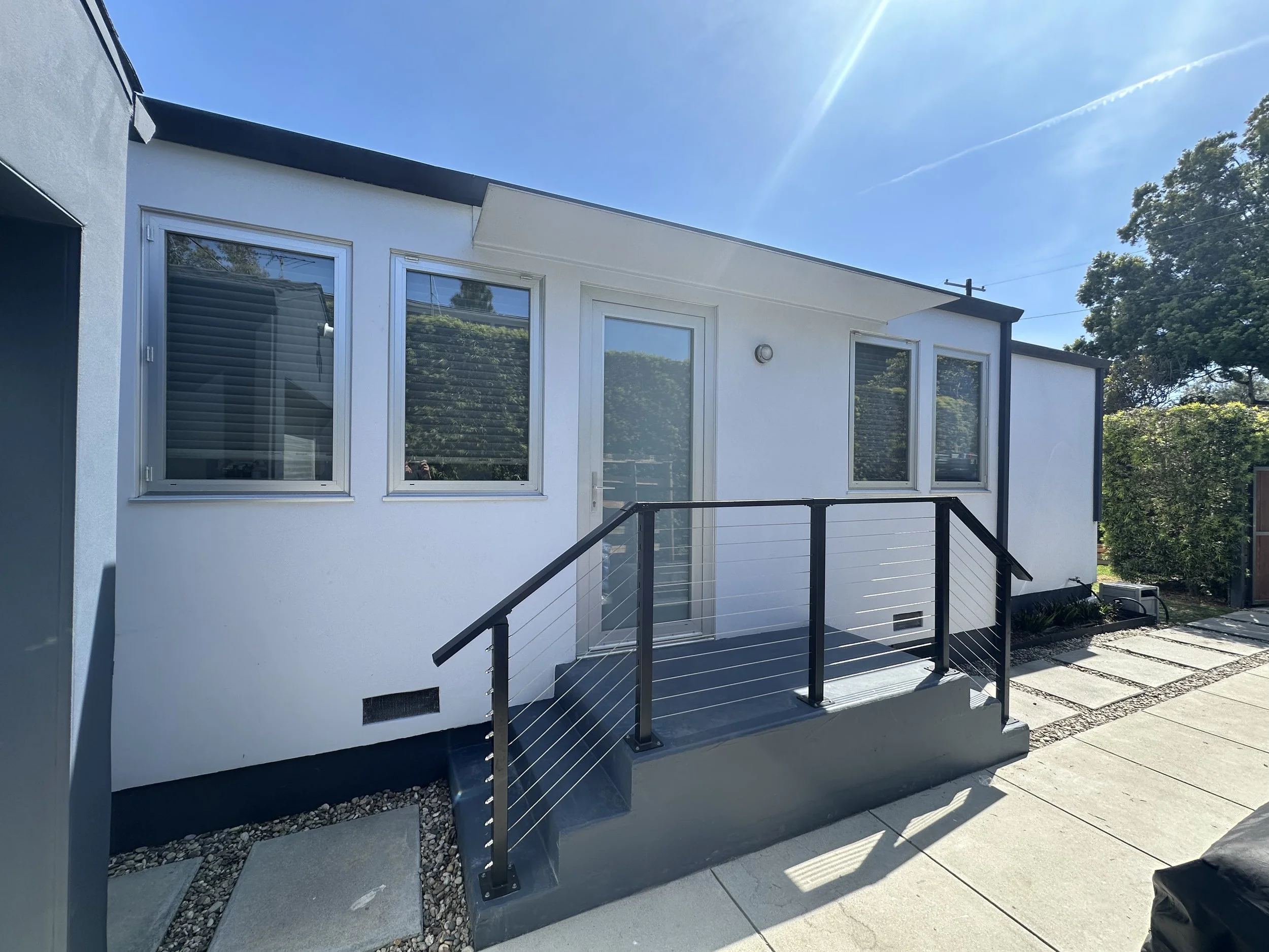  access ramp with black handrails – exterior upgrade by Jewison Company