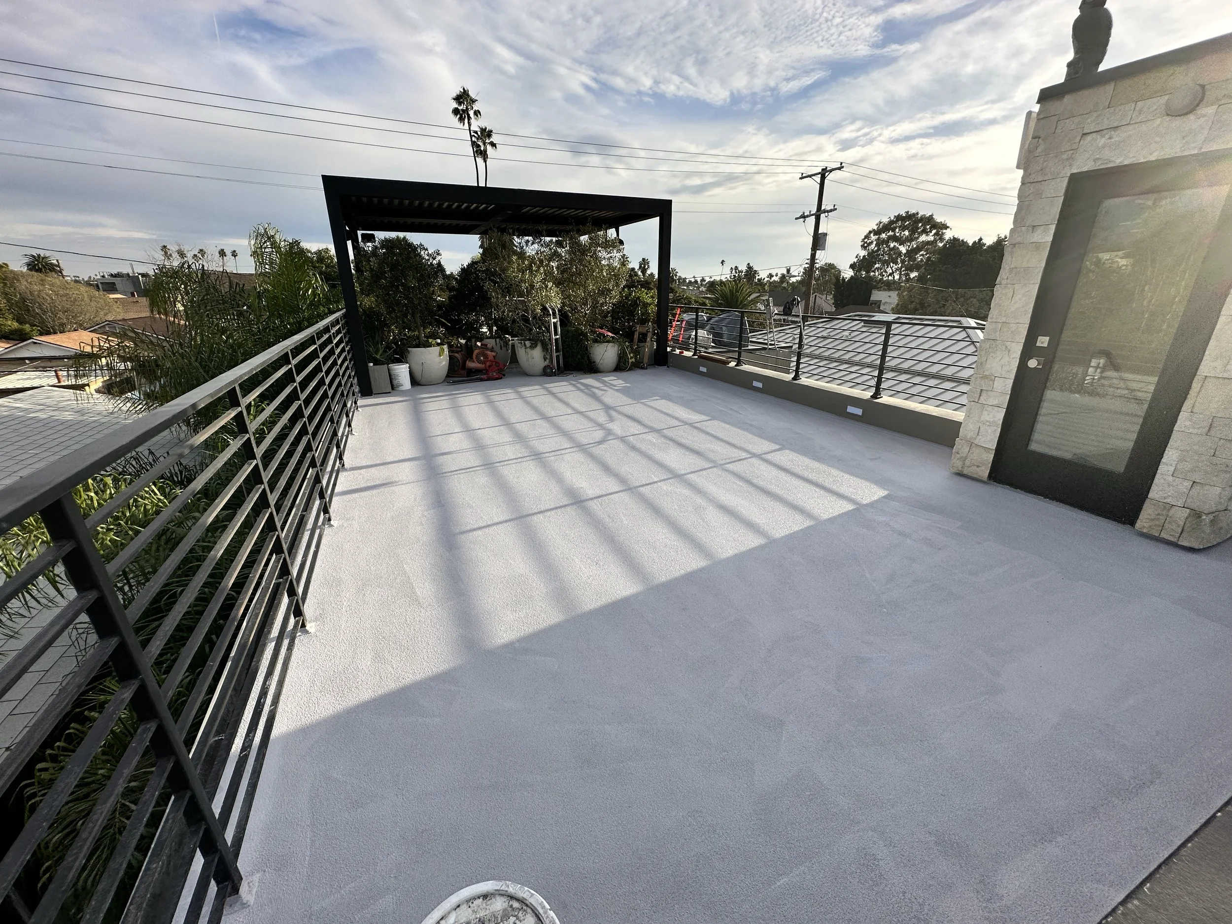 lat rooftop patio with metal railing – multi-unit property care project in LA