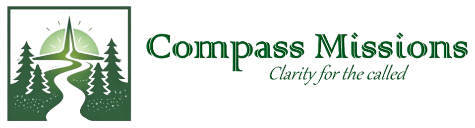 Logo for Compass Missions featuring a winding pink trail through green pine trees leading to a green mountain with a compass on top, and the text 'Compass Missions' with the tagline 'Clarity For The Called'.