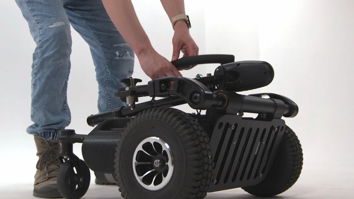 Person adjusting the power flex wheelchair attachment