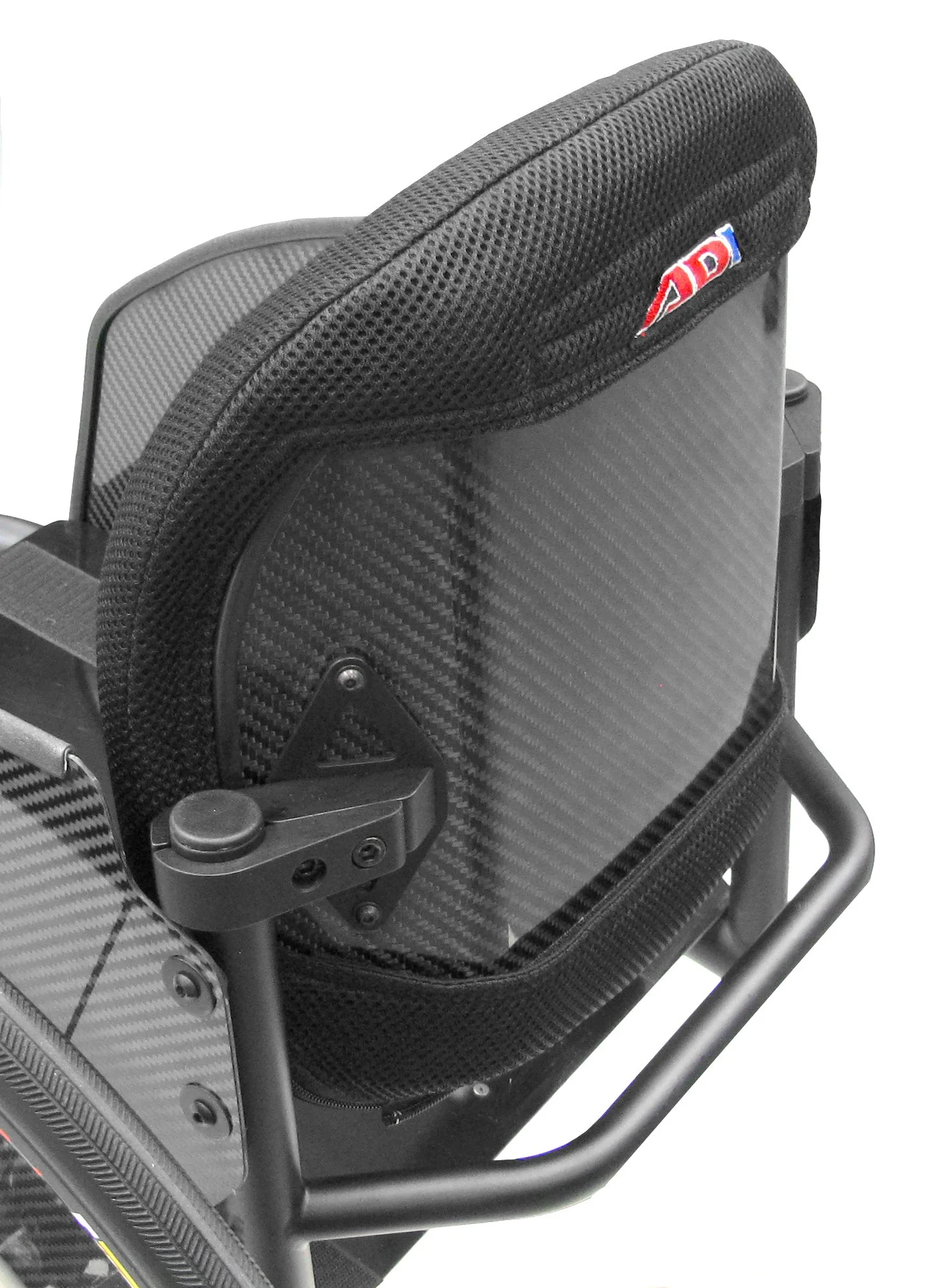 Close-up view of a carbon fiber wheelchair with a padded black mesh headrest and a small partial logo.
