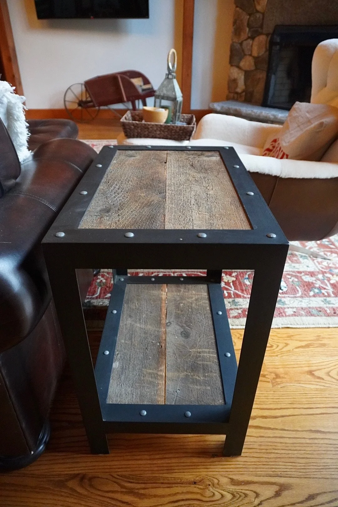A wooden and metal side table in a living room