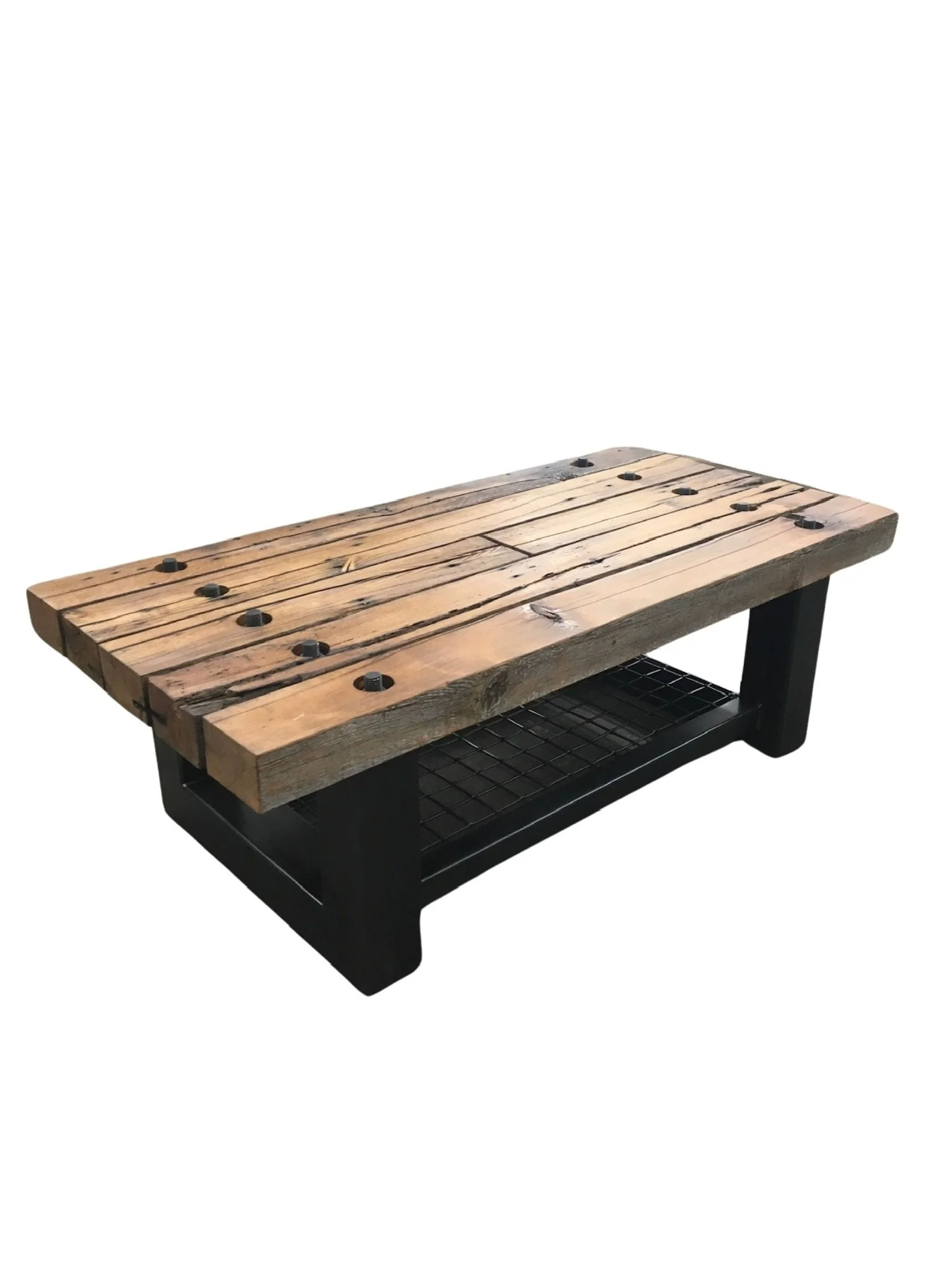 A rustic coffee table with a wooden top and black metal base, featuring a lower shelf with a black wire grid.