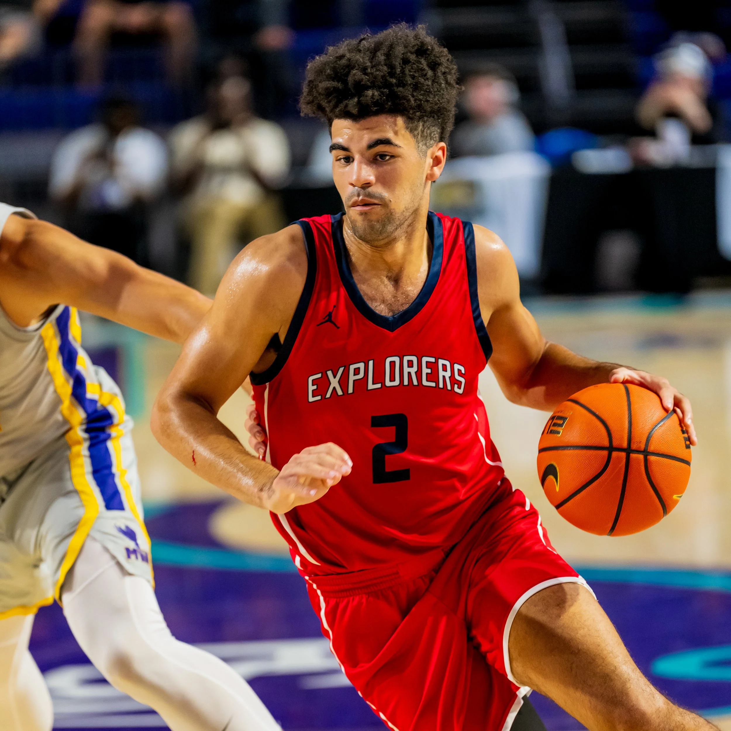 A basketball player in a red jersey with the number 2 and 