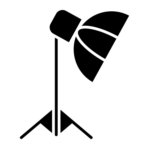 A black dog laying on a bed in a room with wooden furniture.
