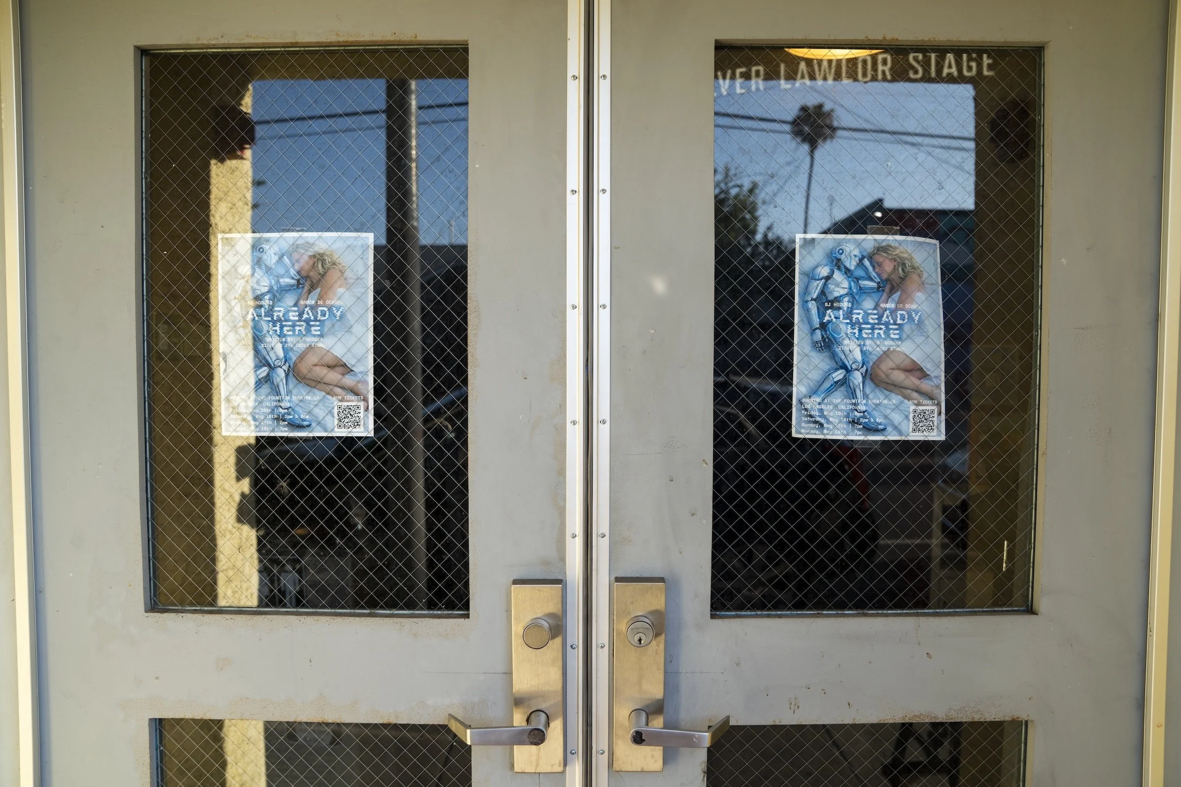 Photo of the doors to the LA performance with the Already Here playbill