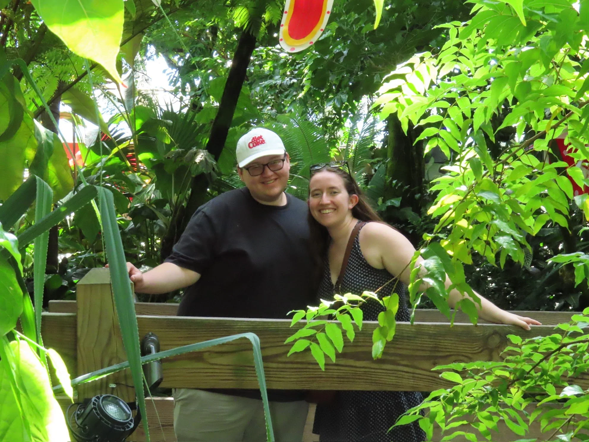 Two friends surrounded by greenery at the botanical gardens in Madison, WI.