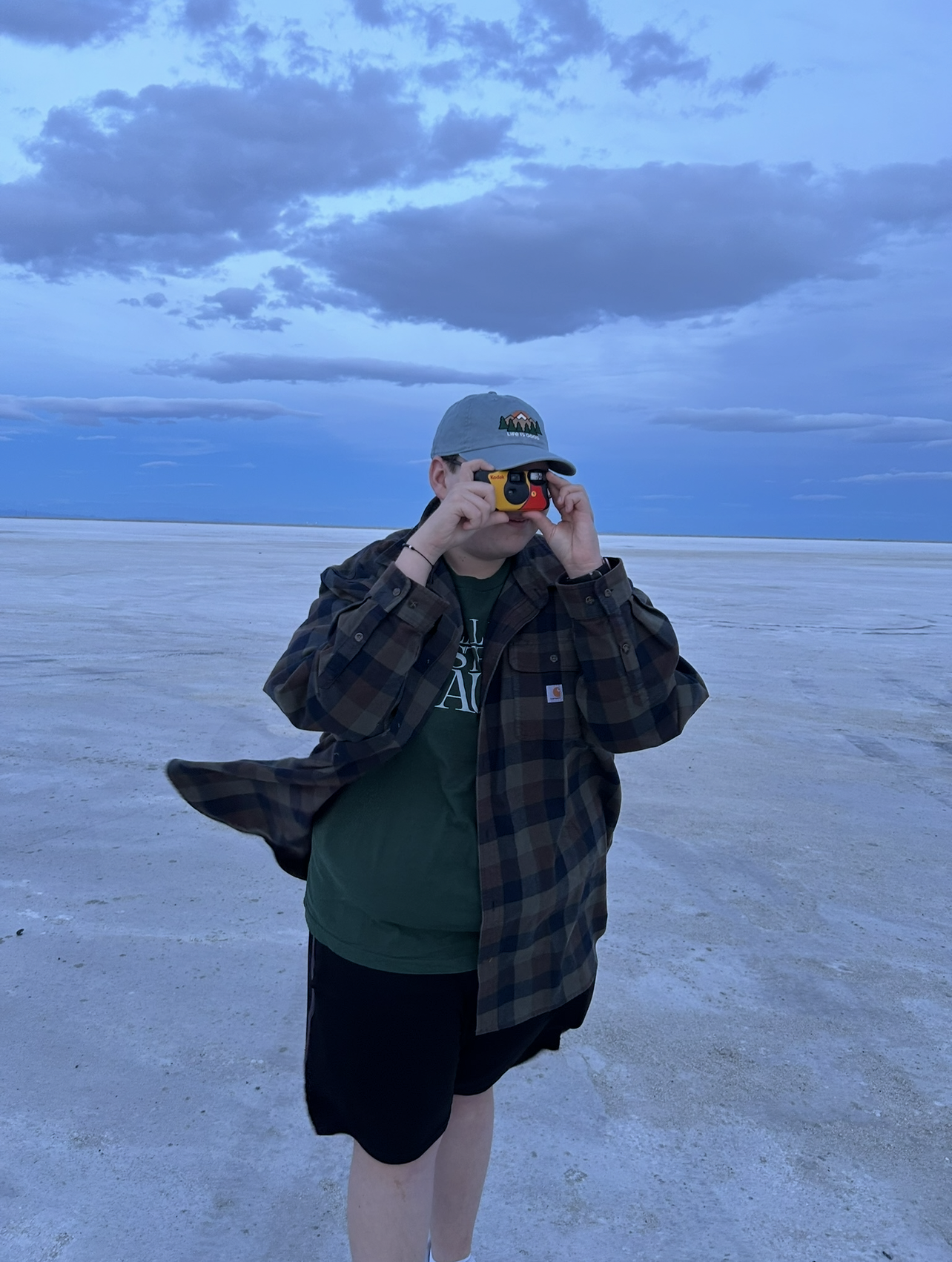 Traveler taking a photo at the Salt Lake City salt flats.