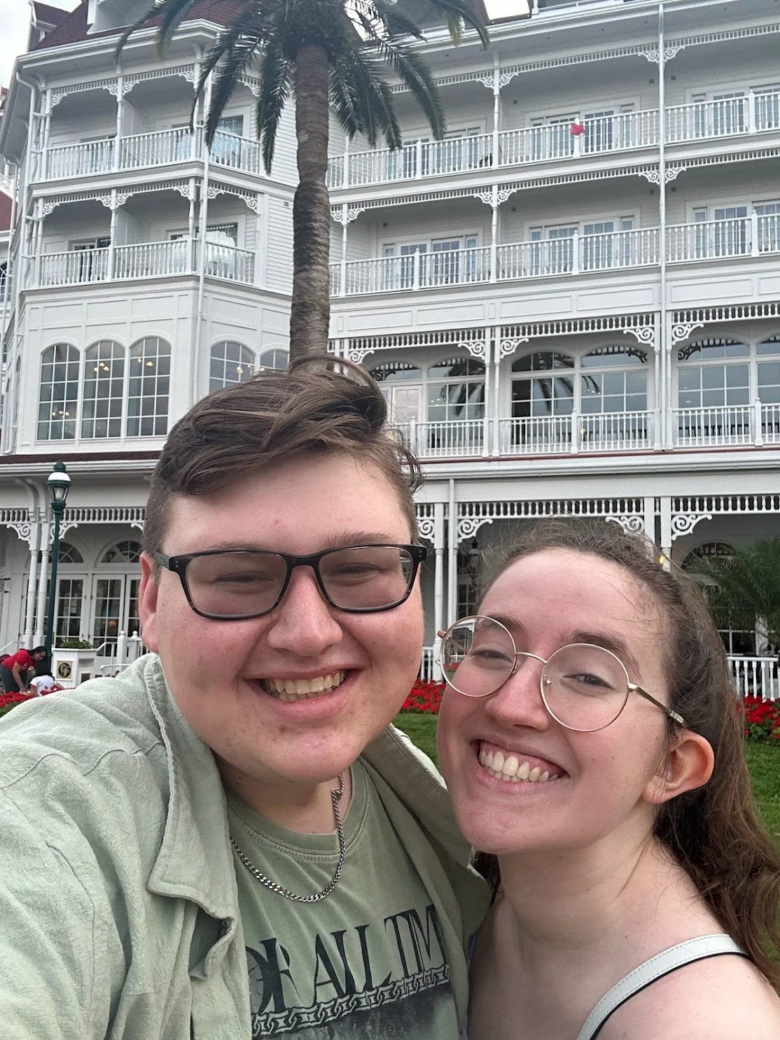 Two friends in front of The Grand Floridian Spa in Walt Disney World.