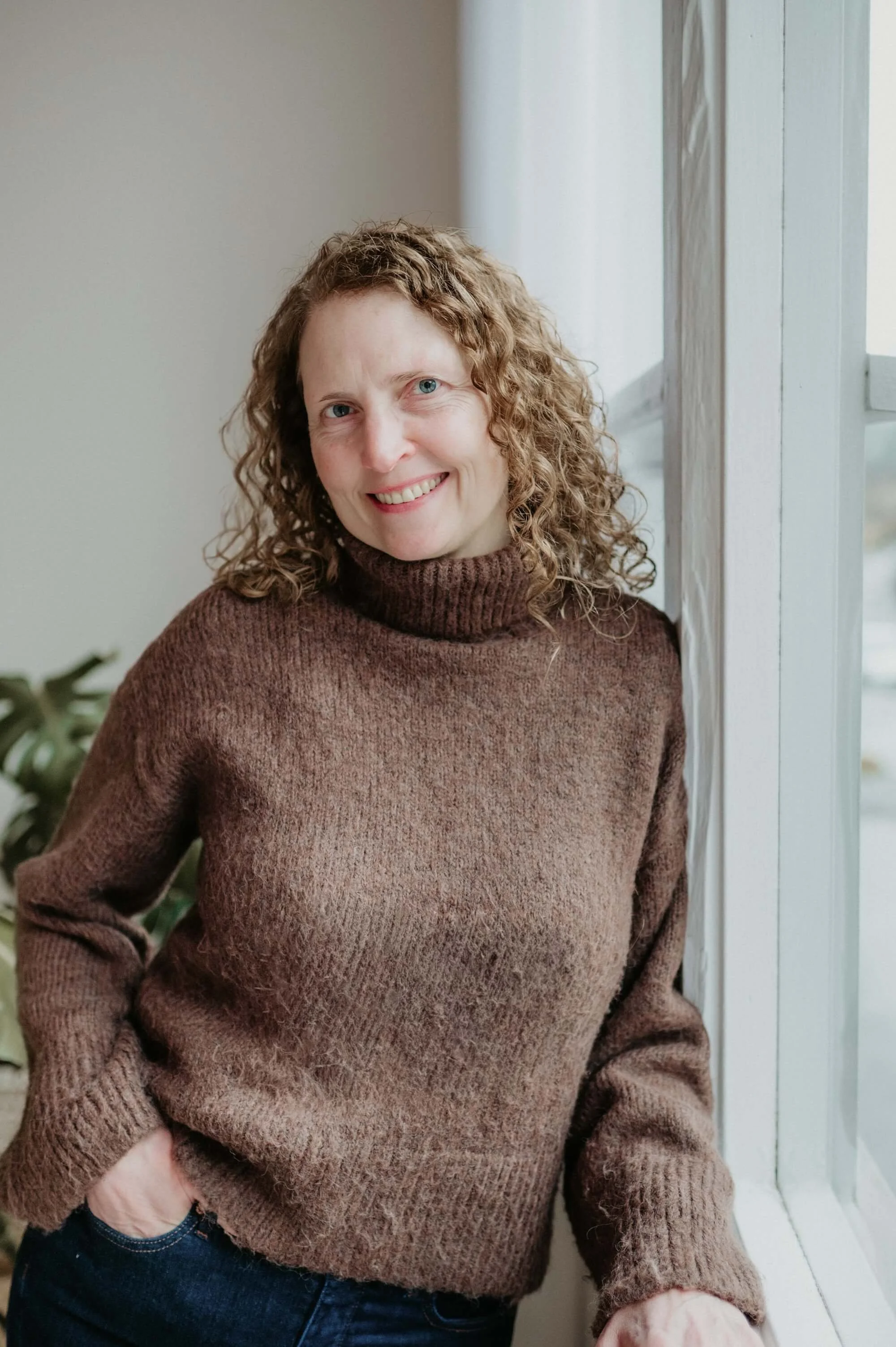 Margarita Durham, wellness coach and founder of Durham Coaching, smiling warmly and inviting you to take the first step toward calm and resilience.