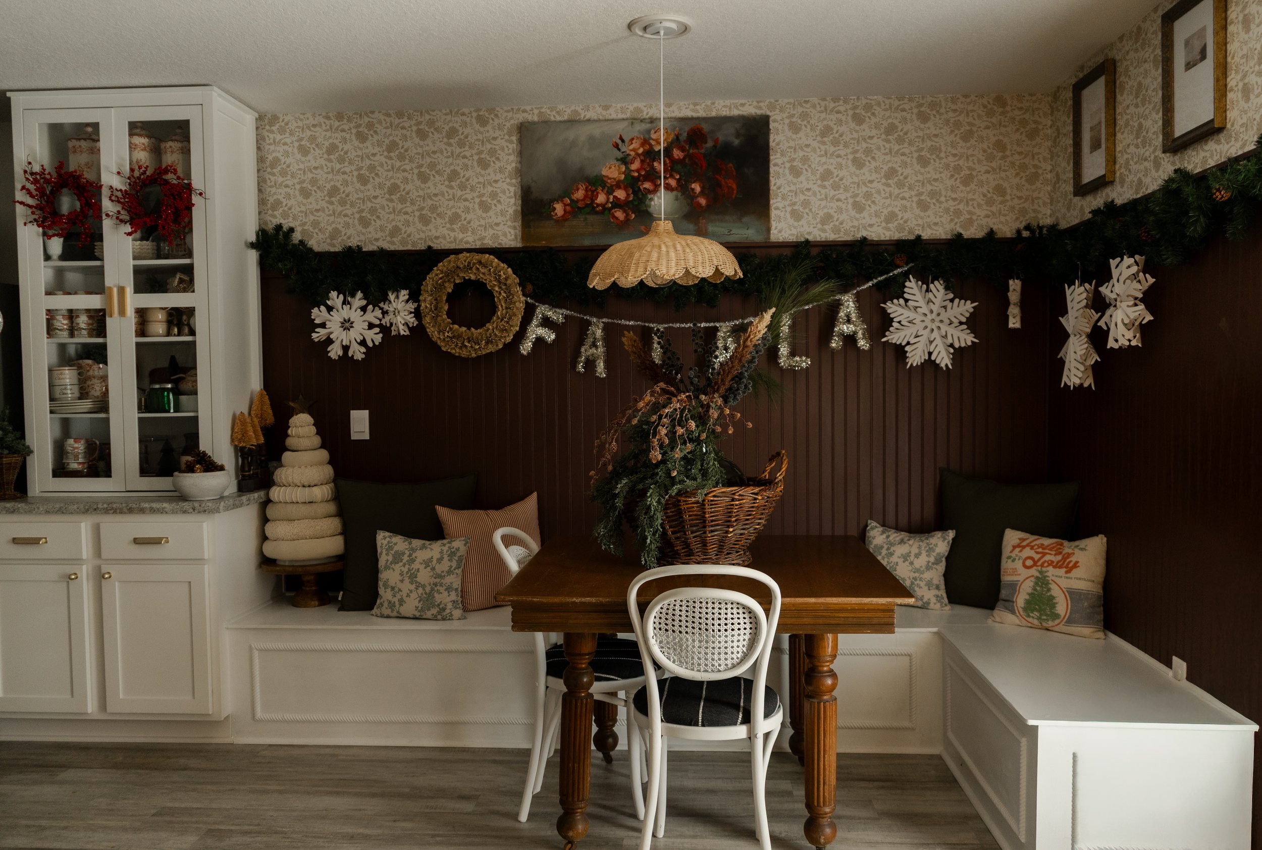 Decorated dining nook with a festive holiday theme, including a 