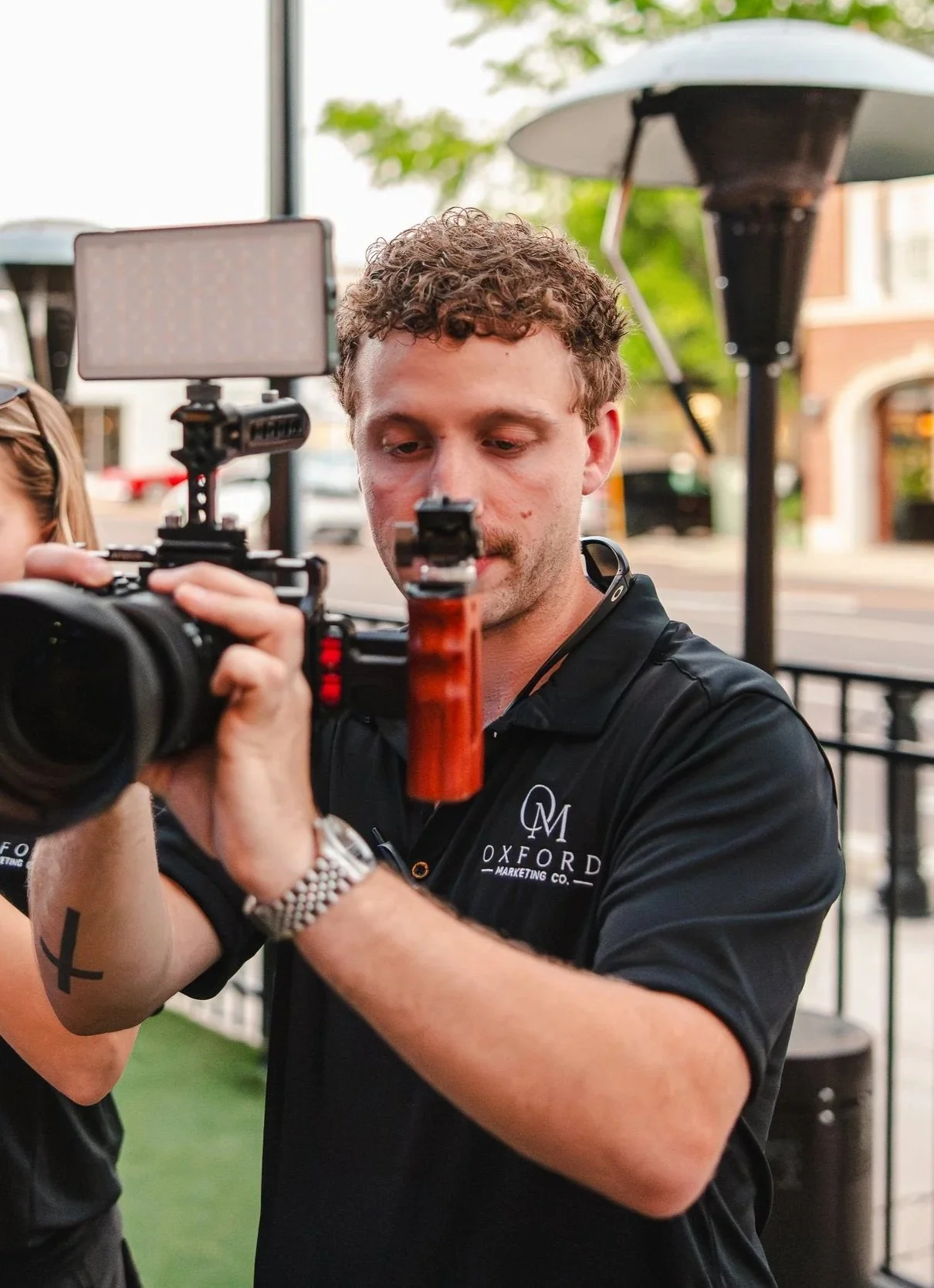 Oxford Marketing Co. founder Jonathan Thurman taking photographs at The Velvet Ditch Seafood & Sports Bar.